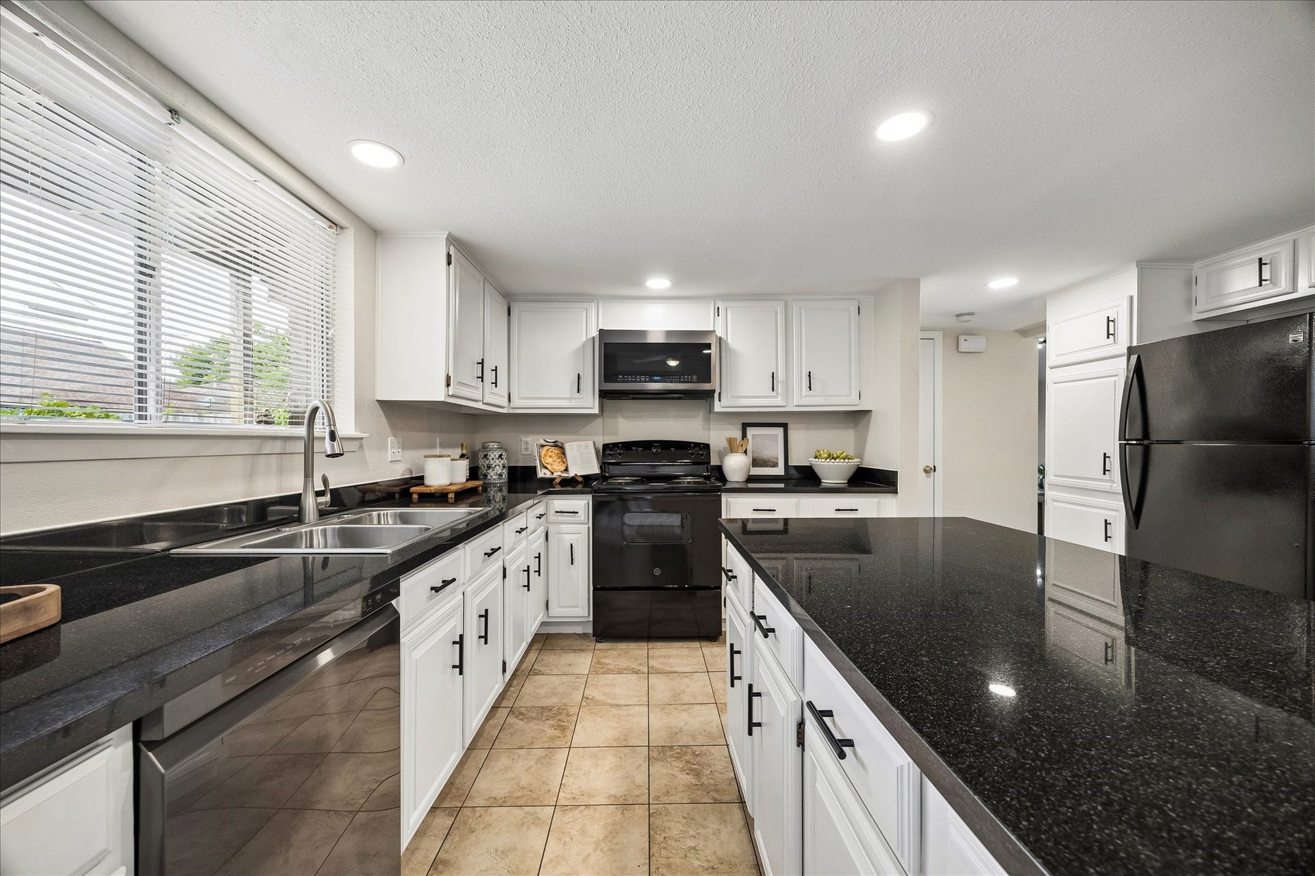 Refreshed kitchen with granite counters and all appliances included.