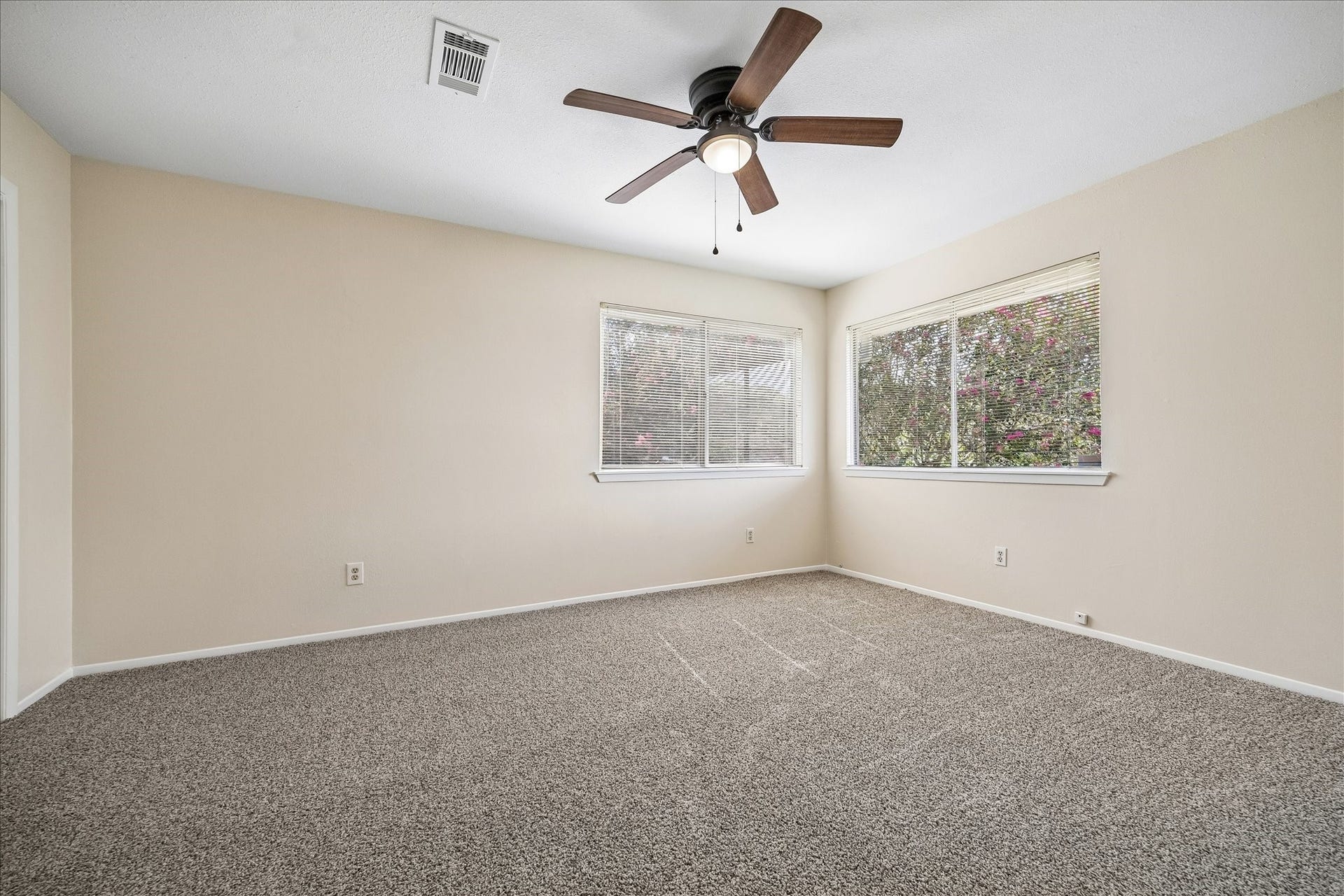 The second of the 2 upstairs bathrooms. Both have great closet space, new carpet and ceiling fans..