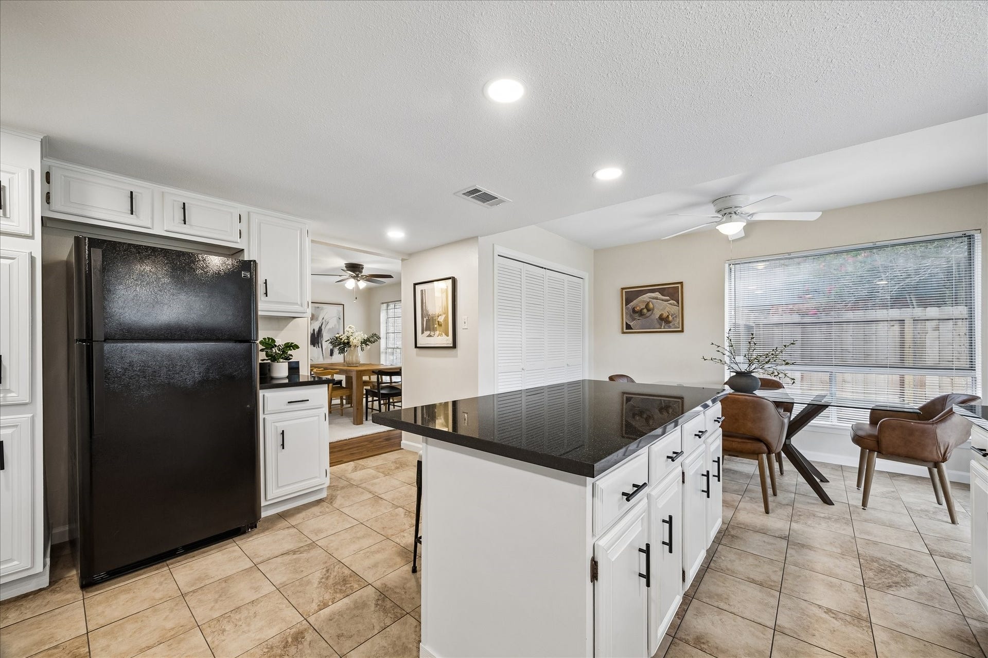 Behind the louvered doors is a full sized washer and dryer. All appliances stay with the home.