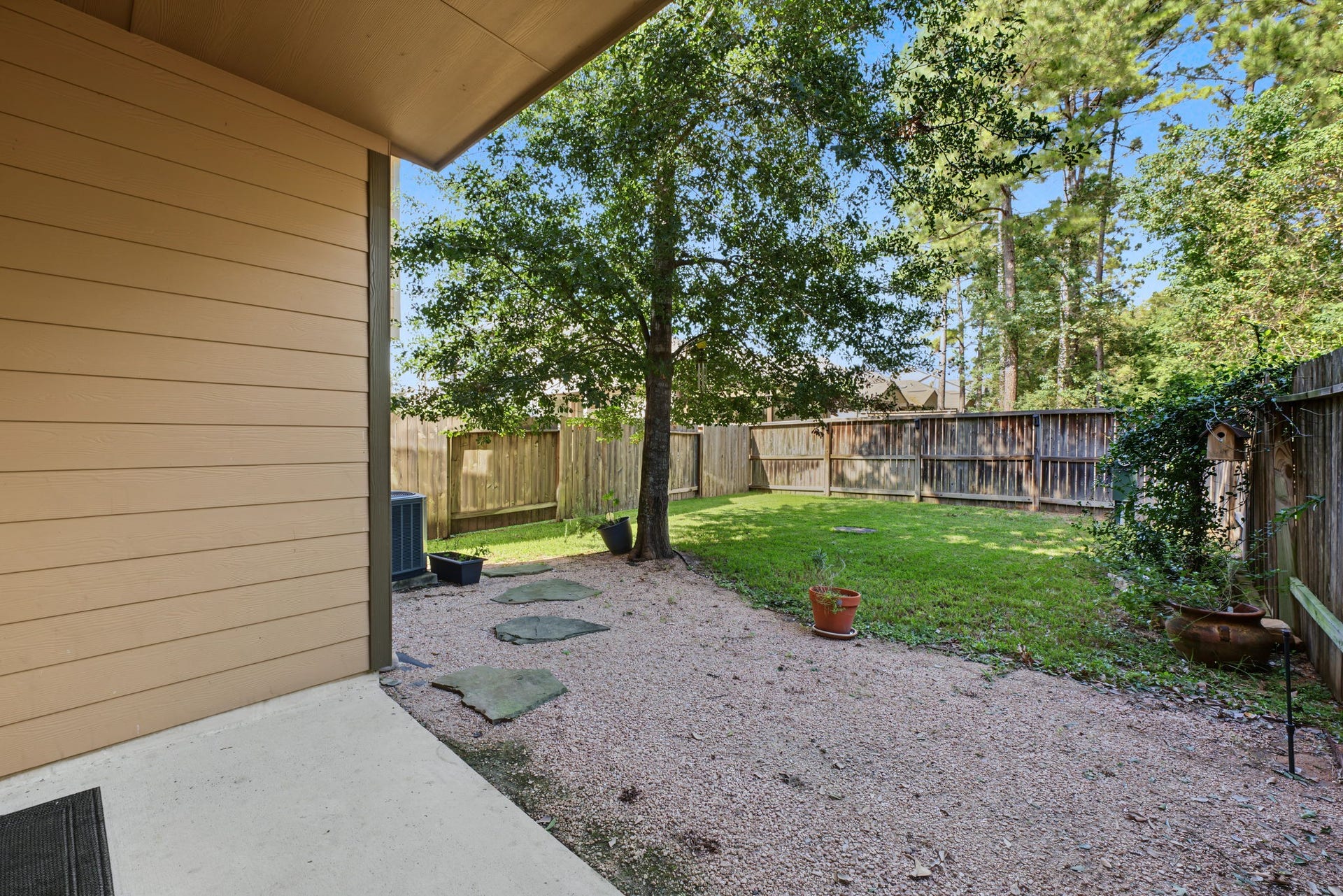 178 Biltmore Loop, Montgomery, TX 77316 Enjoy your view of luscious green trees with no direct rear neighbors.
