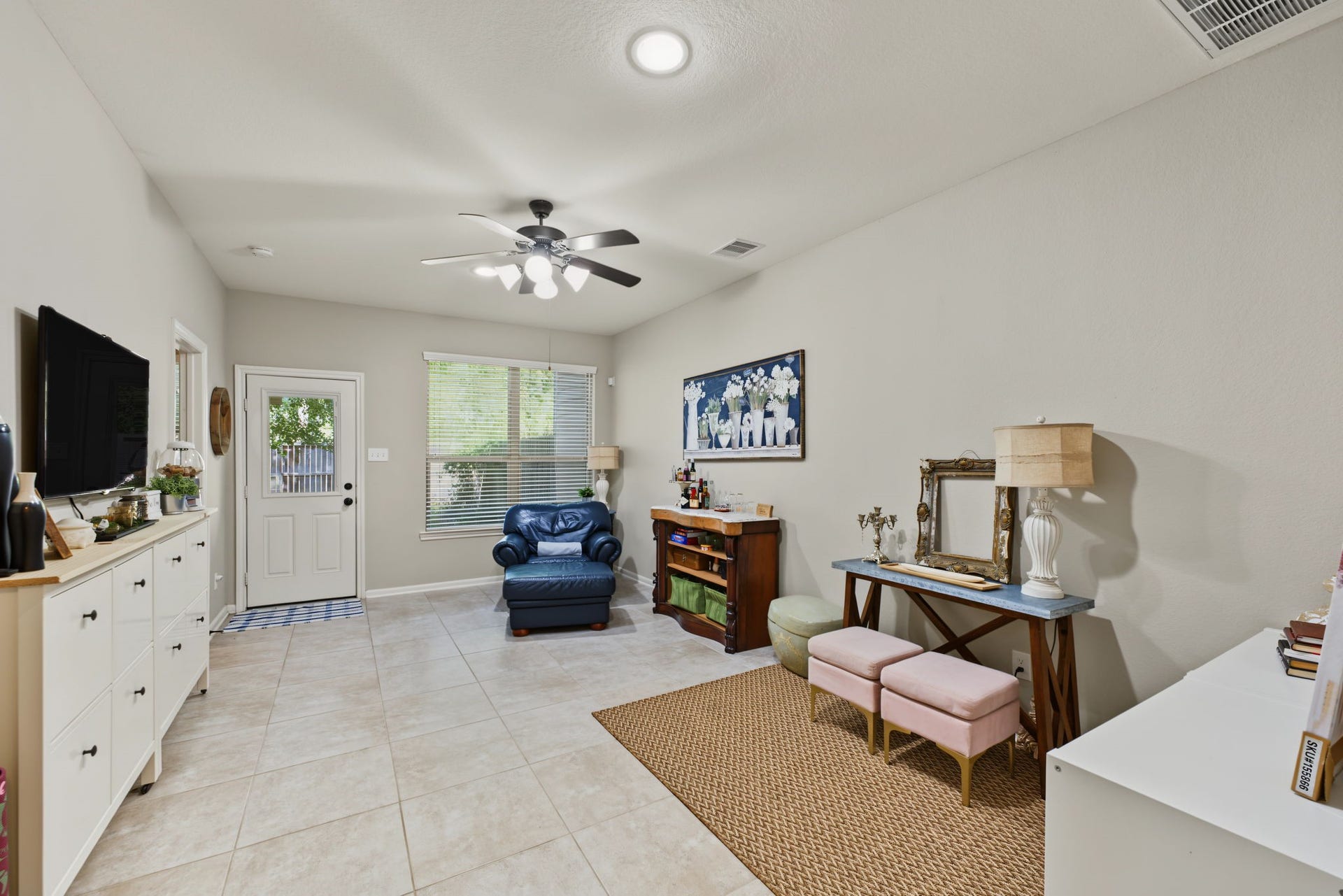 178 Biltmore Loop, Montgomery, TX 77316 Enjoy the downstairs living room, complete with neutral flooring, a ceiling fan, and a layout ready for everyday living.