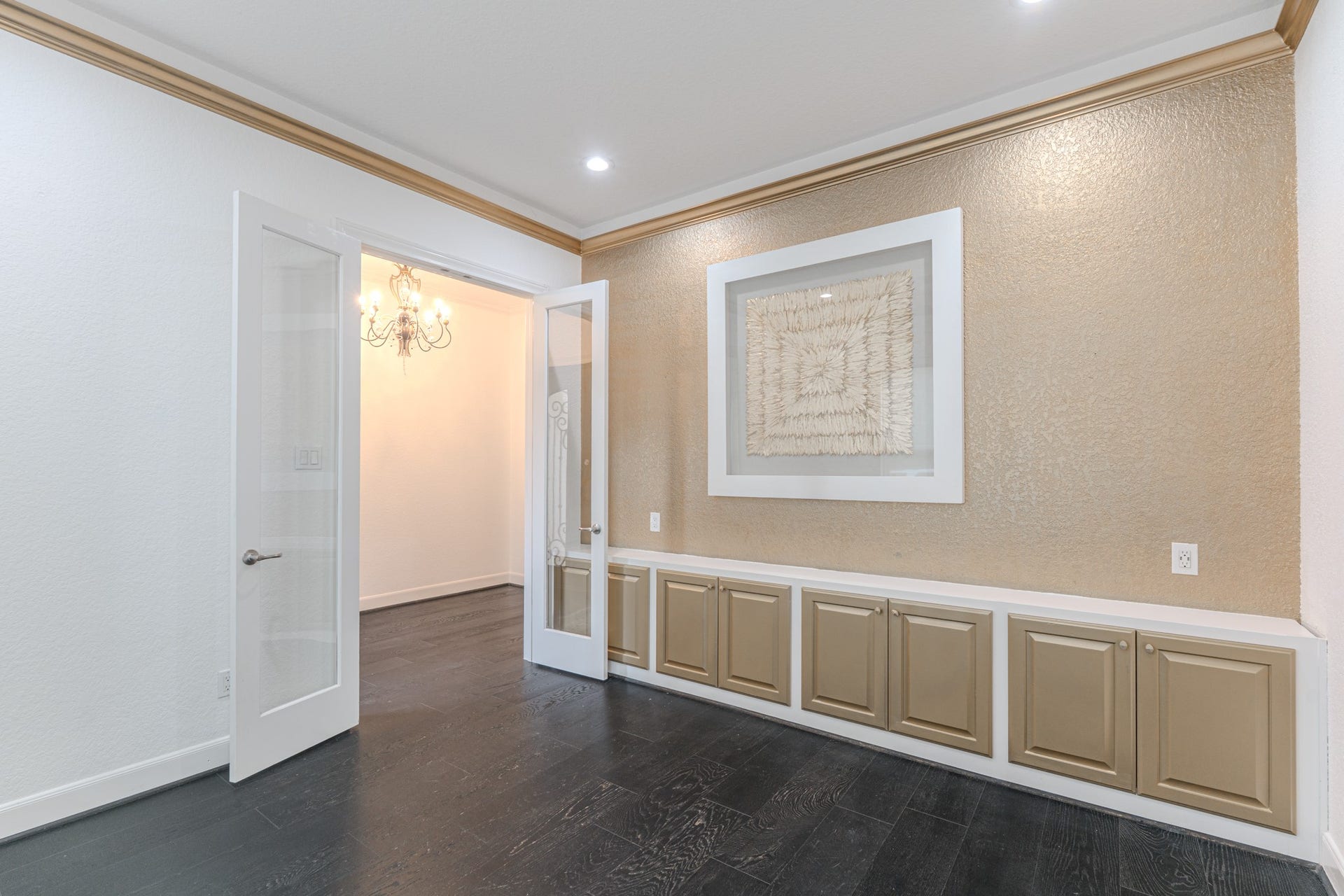 Home office or study with french doors, Builtin cabinets for storage.
