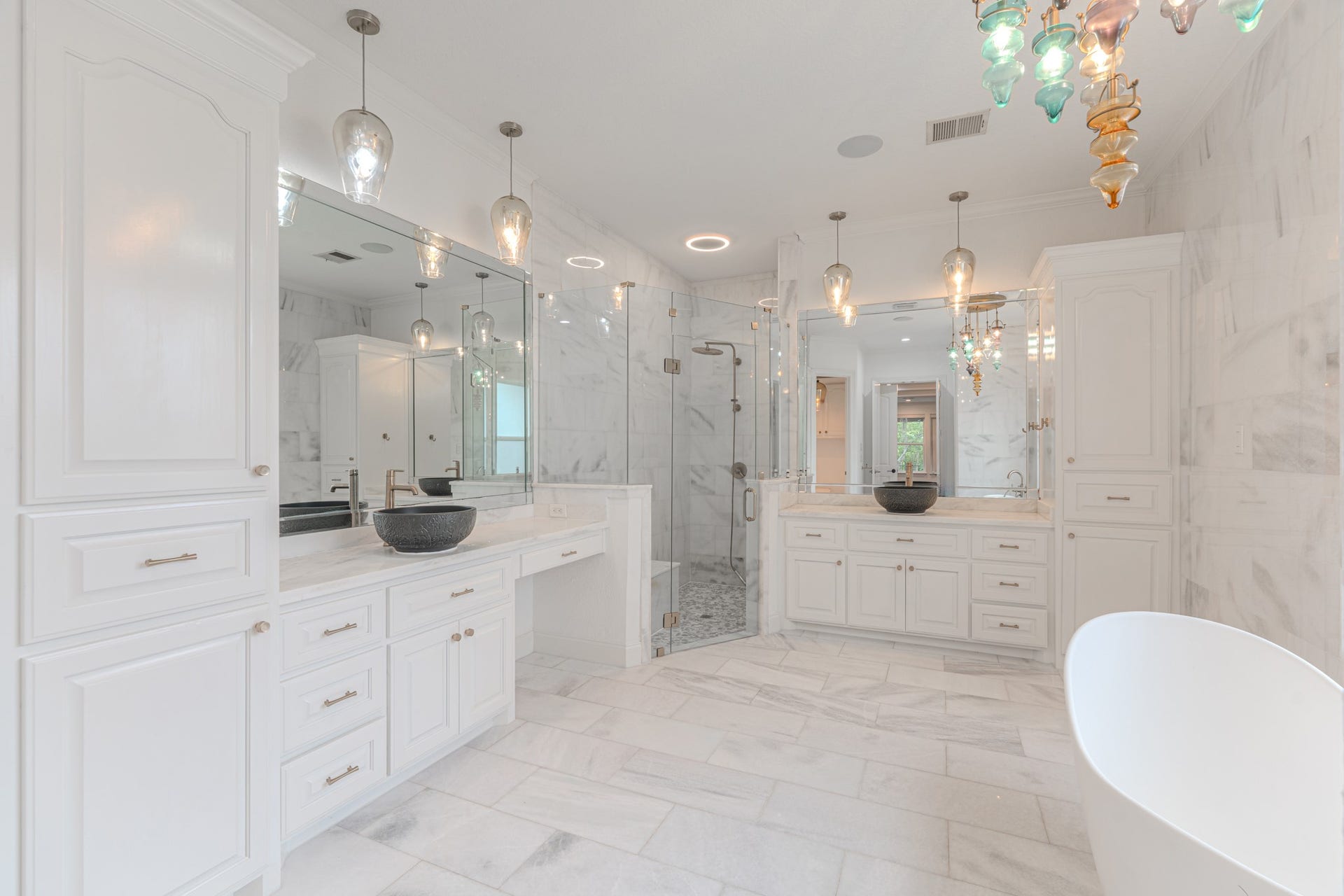 Every detail in this bathroom is perfection from the marble to the oversized walk in shower.