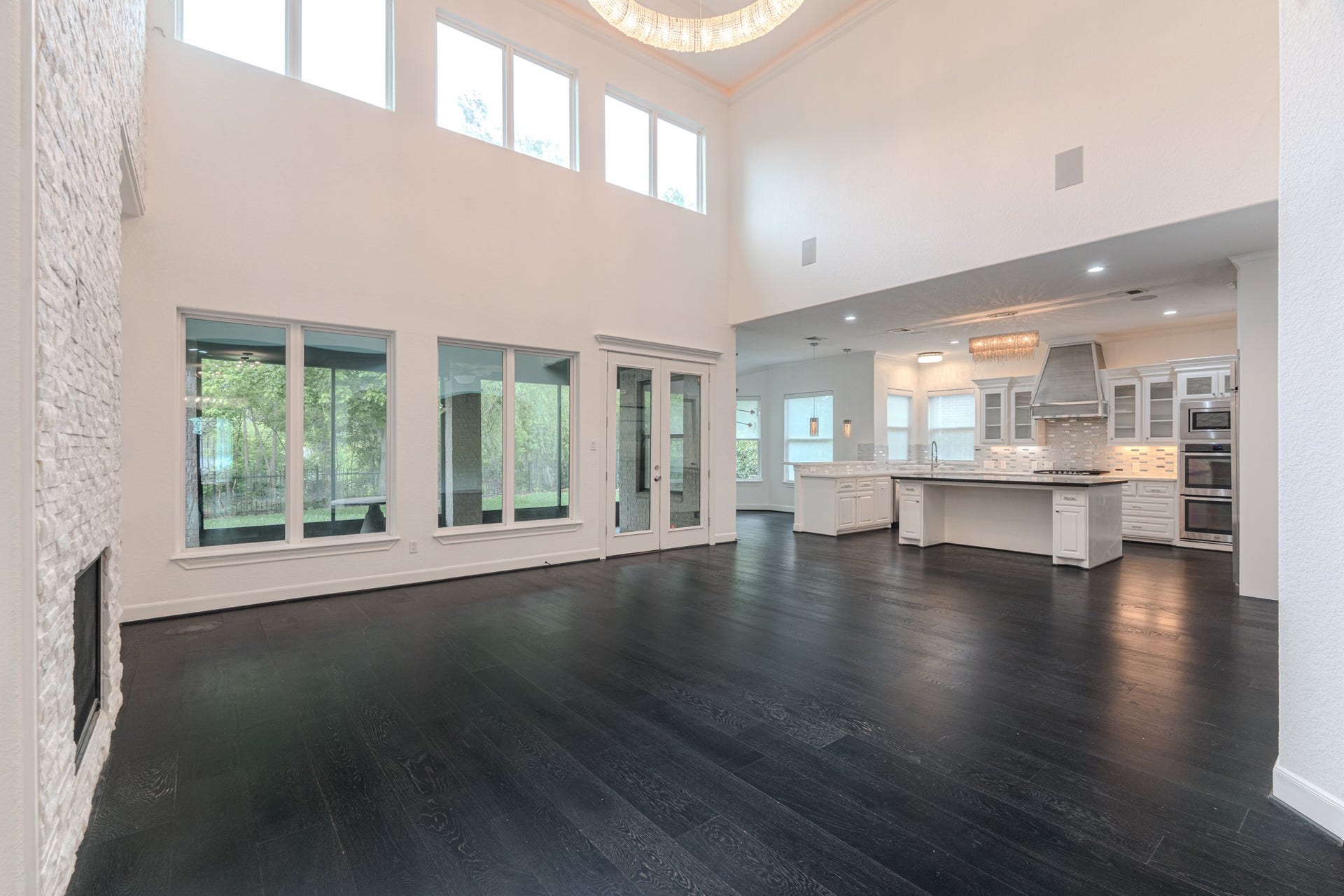 Views on views, Gorgeous open central family room with so many details from the stacked stone fireplace, to the Restoration Hardware 56" chandelier, 2-story ceilings with cove lighting detail, wall of windows for natural light. Speakers throughout creates a whole experience.