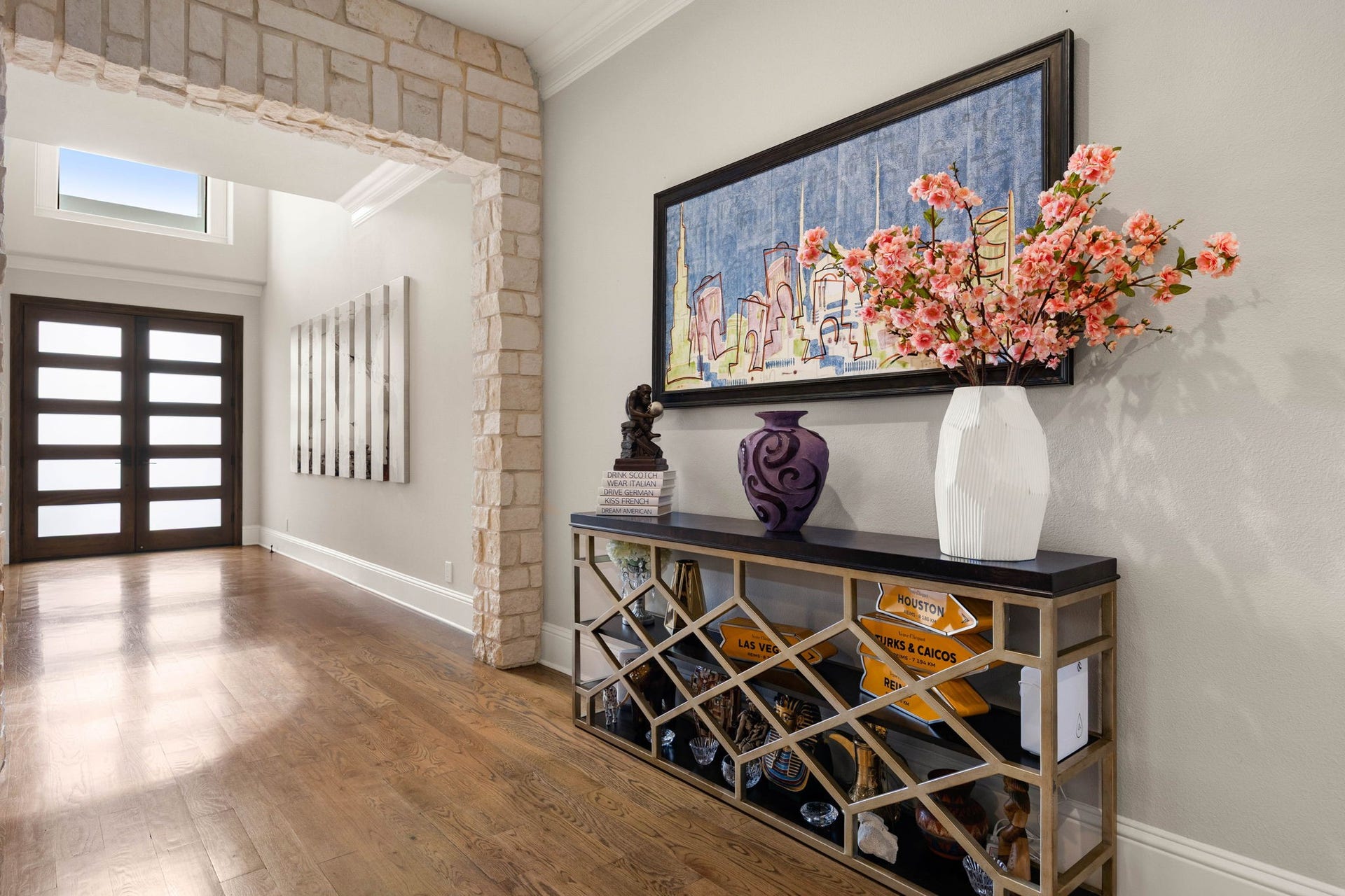 1847 Candlelight Place Drive, Houston, TX 77018 Greeted by a striking stone archway and modern double doors.