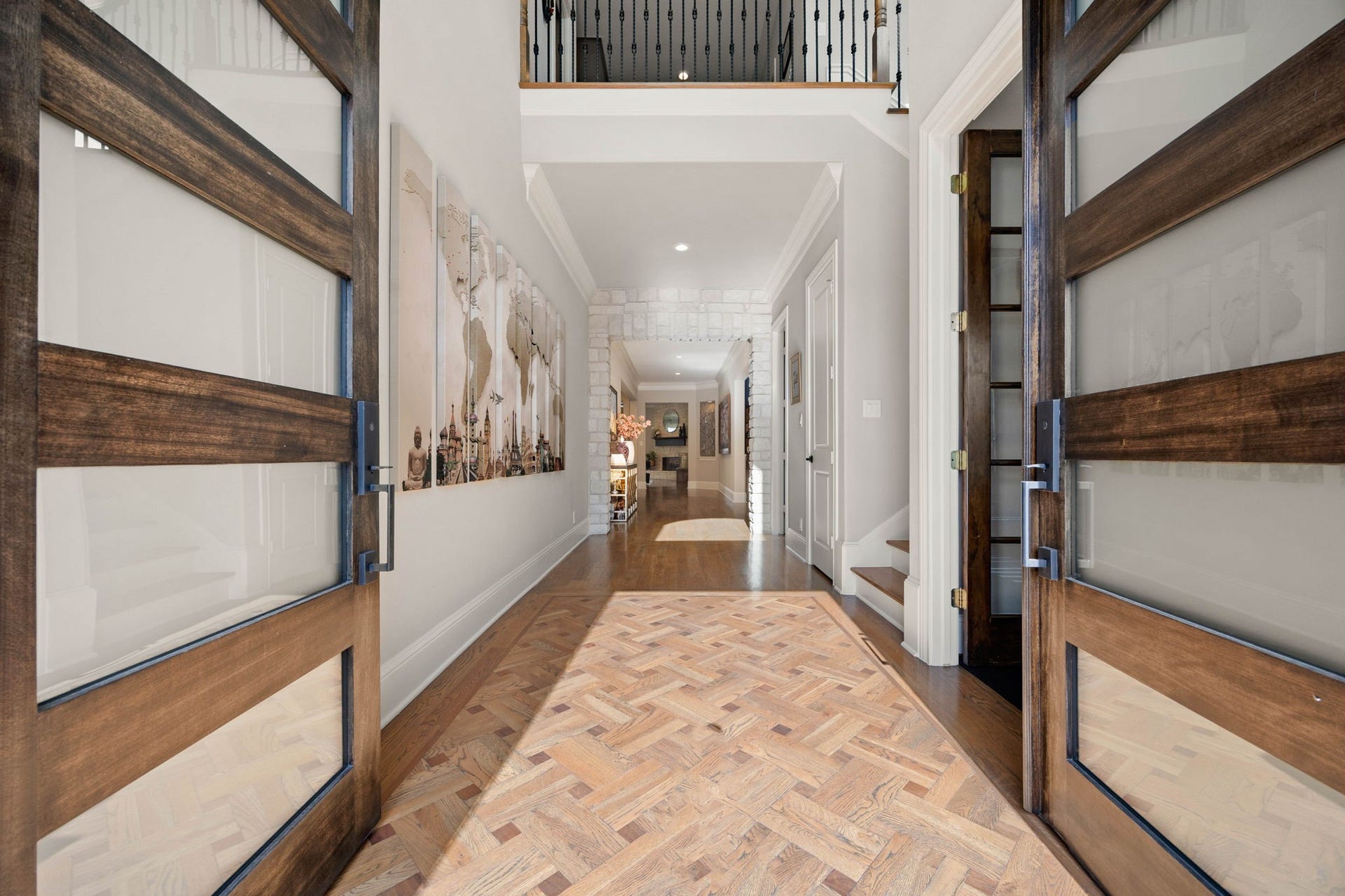 1847 Candlelight Place Drive, Houston, TX 77018 Elegant entryway with stylish wooden double doors, custom basket-weave white oak flooring, and abundance of natural light, leading to a spacious and inviting interior.