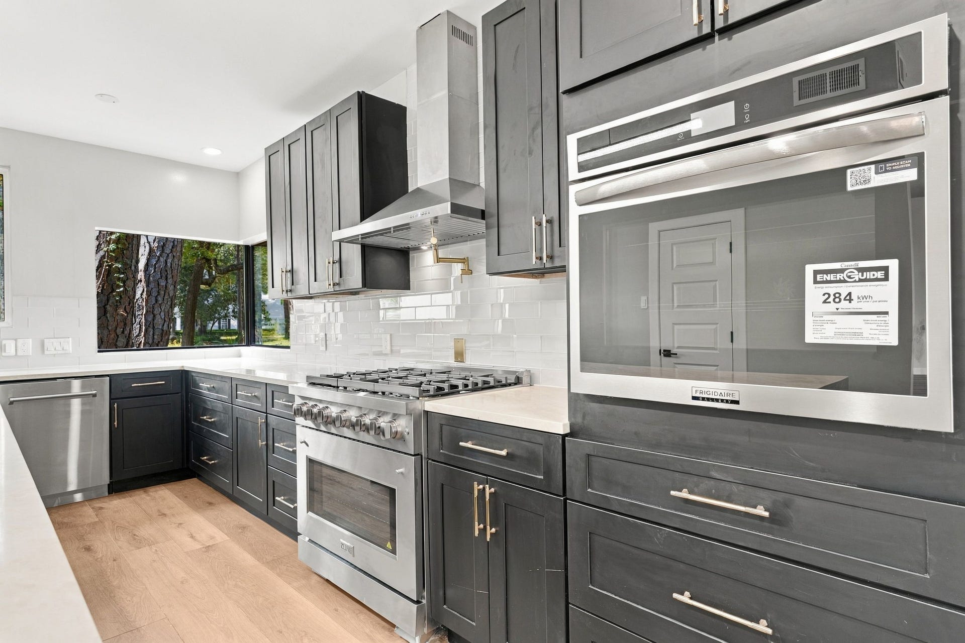 3 Rain Fern Court, The Woodlands, TX 77380 Beautifully designed kitchen equipped with elevated function, style, and space for gathering.