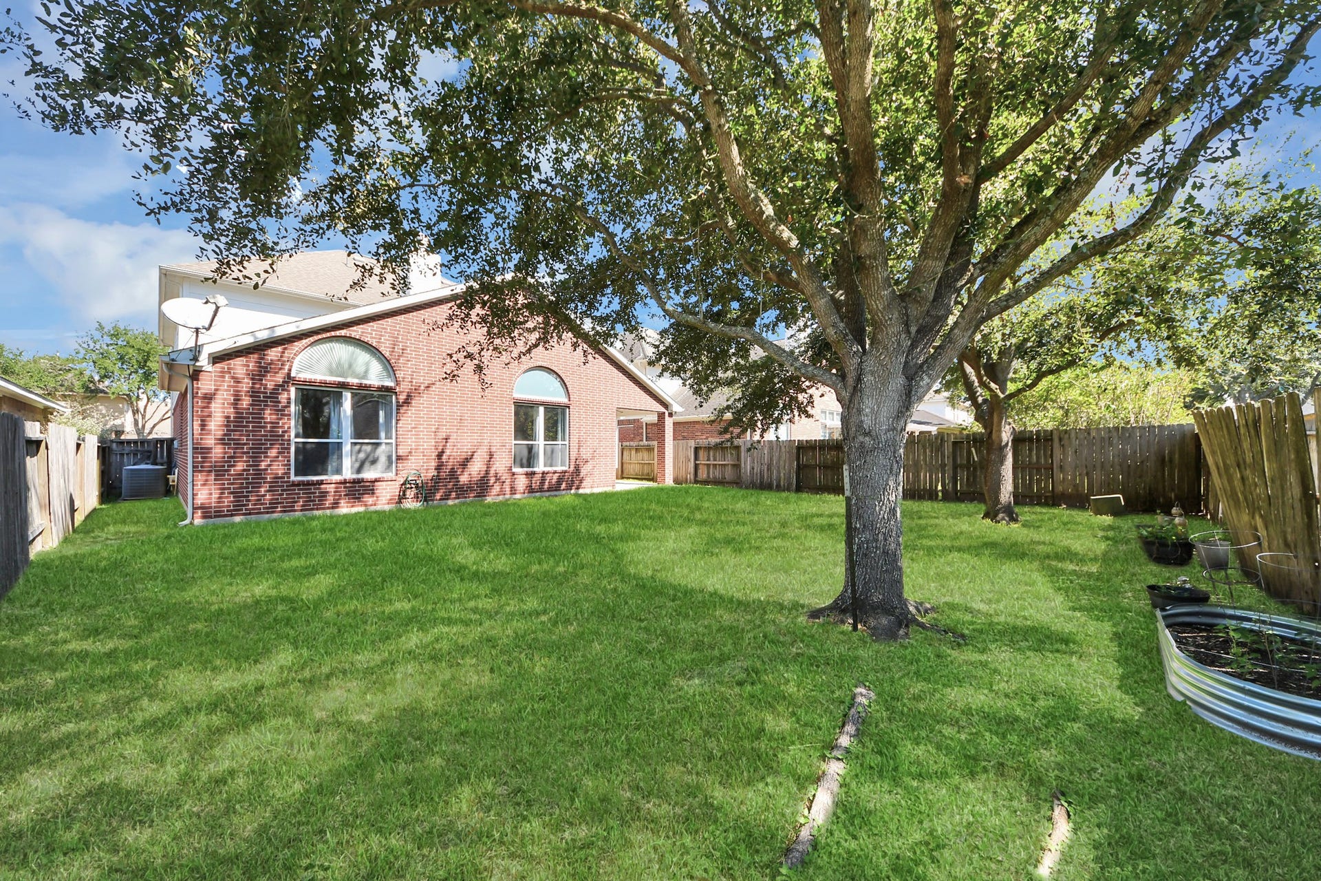 6114 Hollydale Ridge Lane, Katy, TX 77494 Backyard with mature shade trees