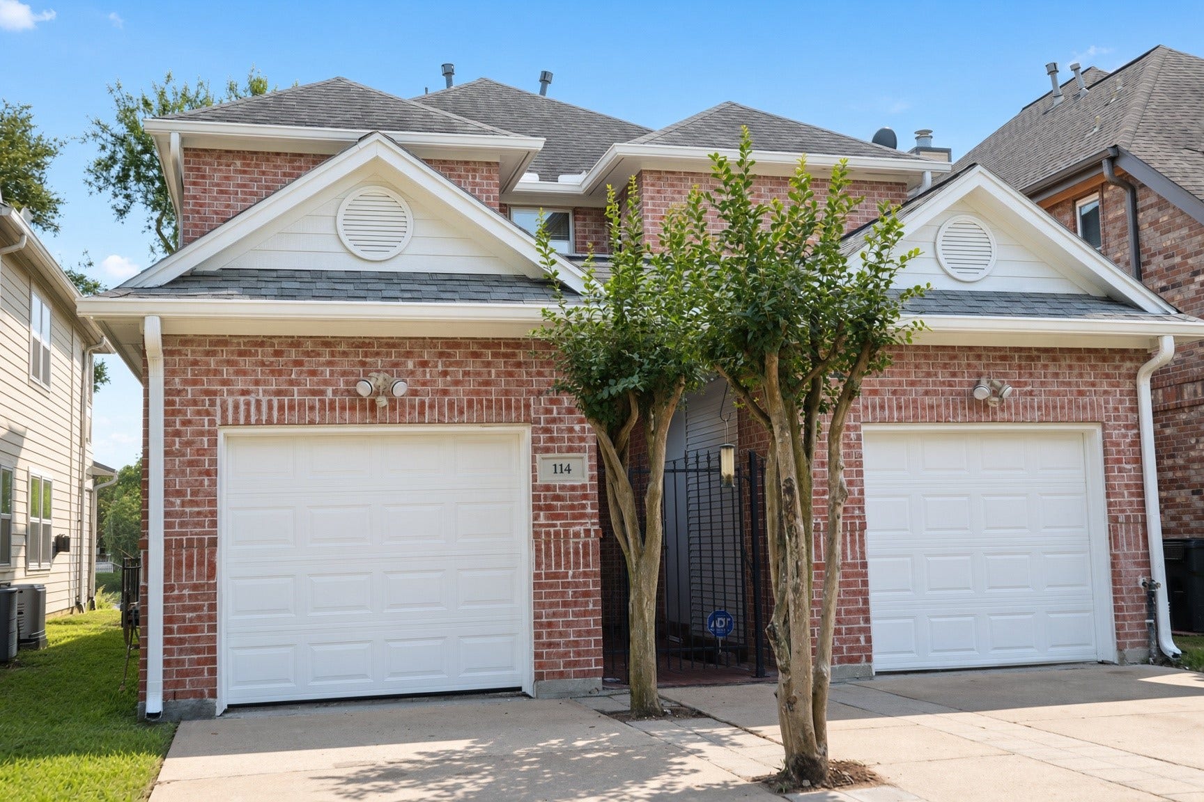 114 Oyster Creek Drive, Sugar Land, TX 77478 Inviting entry, with 2 car, split garages at the front of the home.
