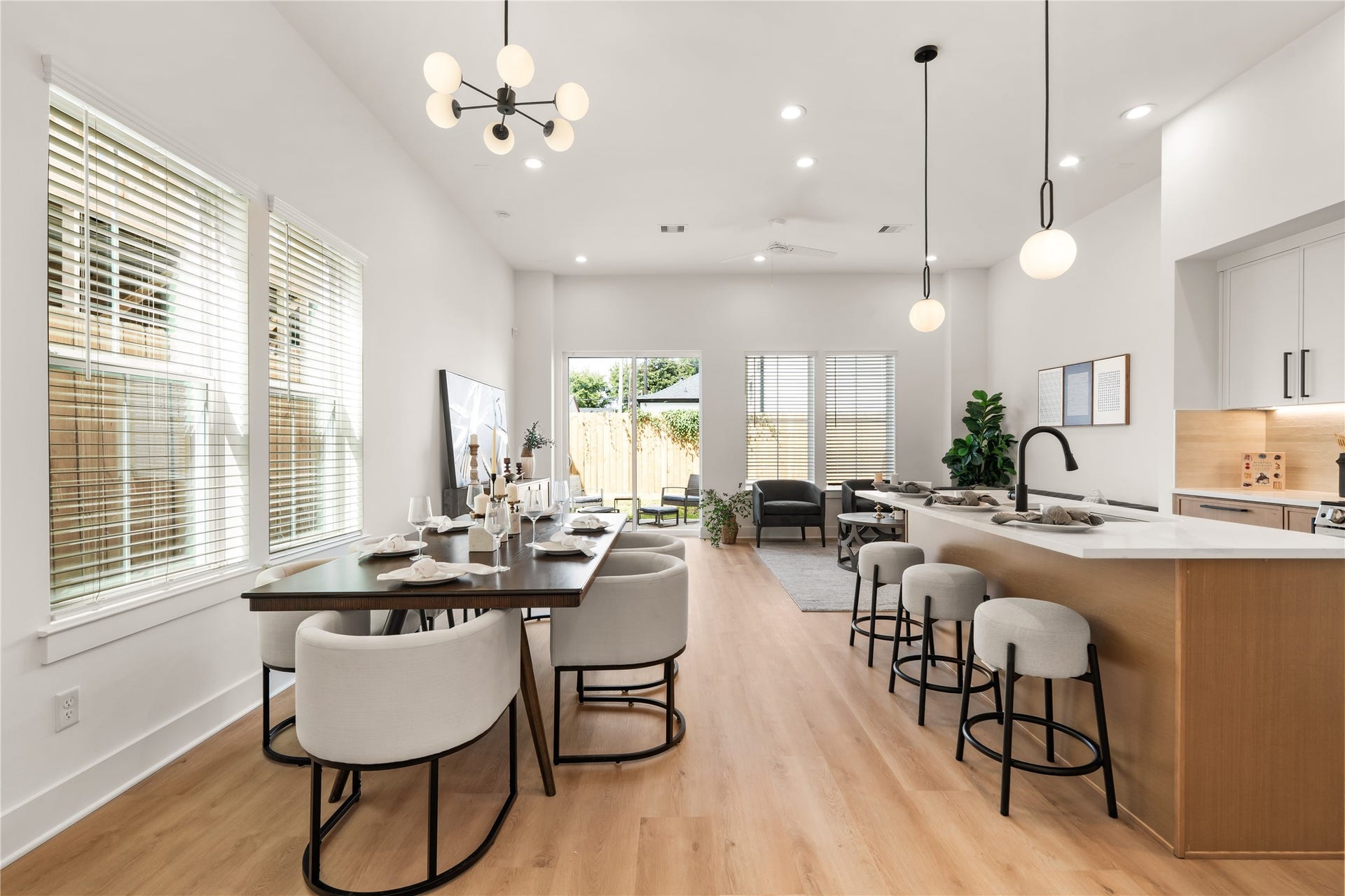 4615 Buck Street, Houston, TX 77020 Sunlit open-concept main floor seamlessly connecting dining, cooking, and living spaces.