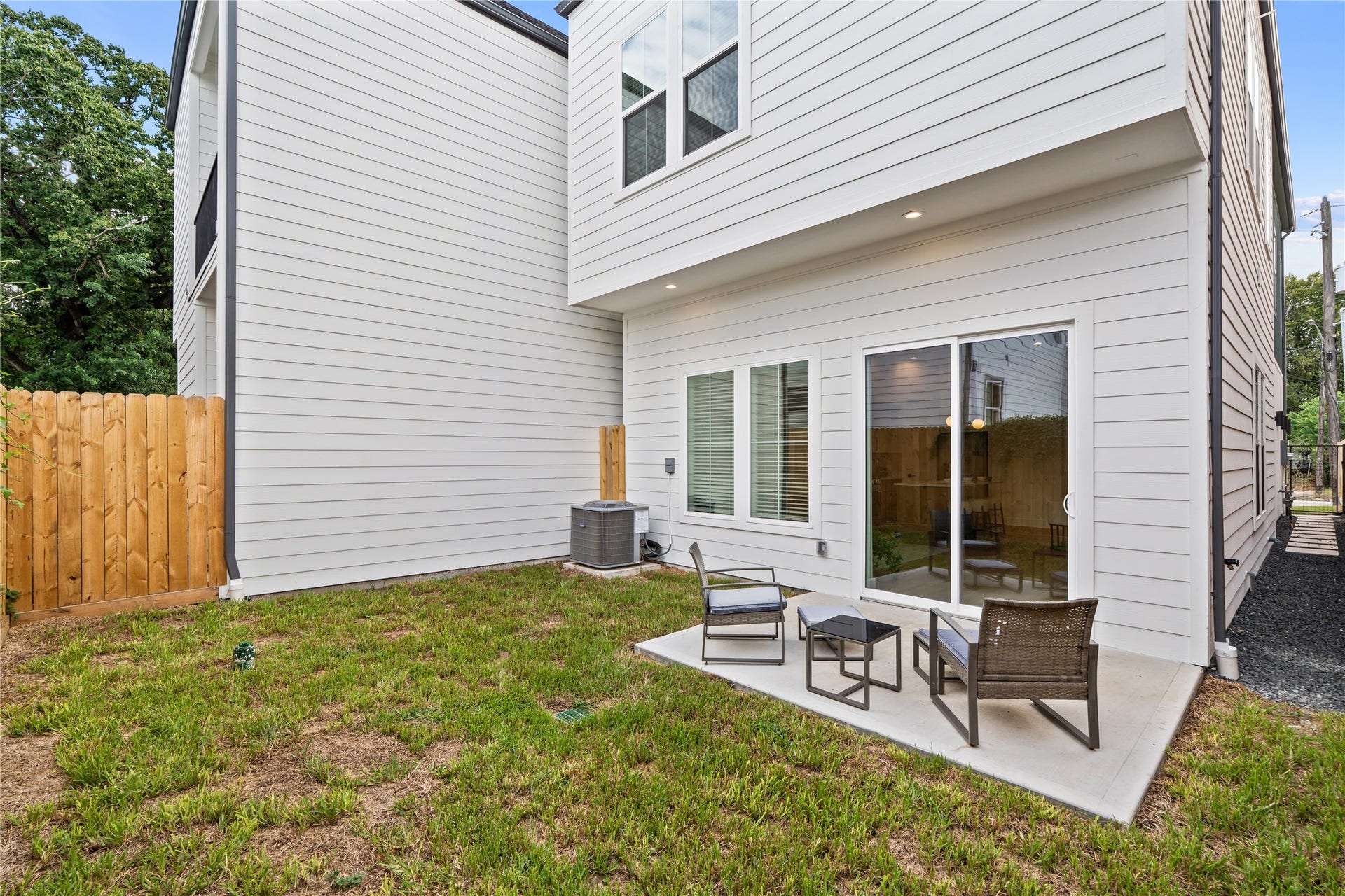 4615 Buck Street, Houston, TX 77020 Low-maintenance green space and concrete patio providing seamless indoor-outdoor access.