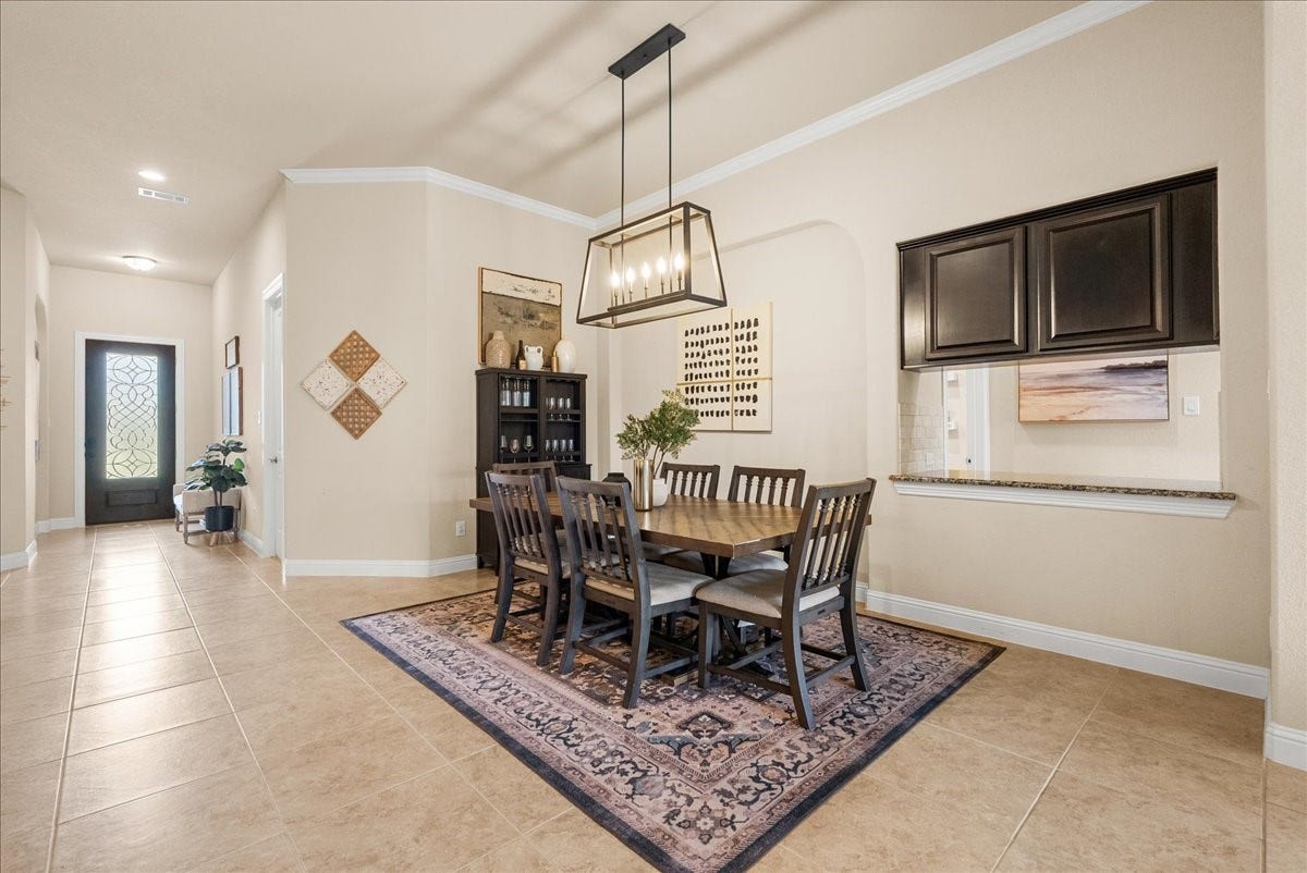 1413 Coffee Mill Court, League City, TX 77573 The formal dining area is conveniently located just off the living room and kitchen, creating a seamless flow thats perfect for both everyday living and entertaining.