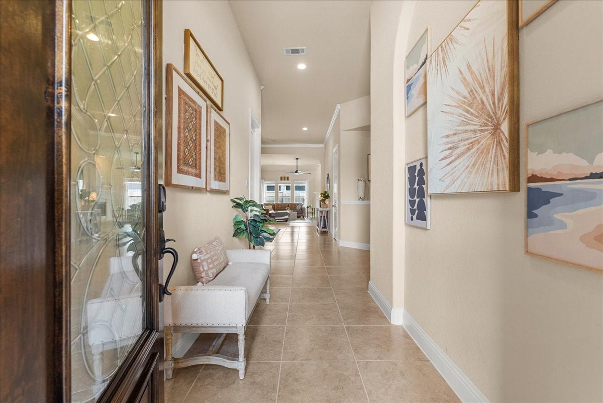 1413 Coffee Mill Court, League City, TX 77573 Enter to soaring ceilings, graceful arched entries, and abundance of natural light creating an impressive welcome.