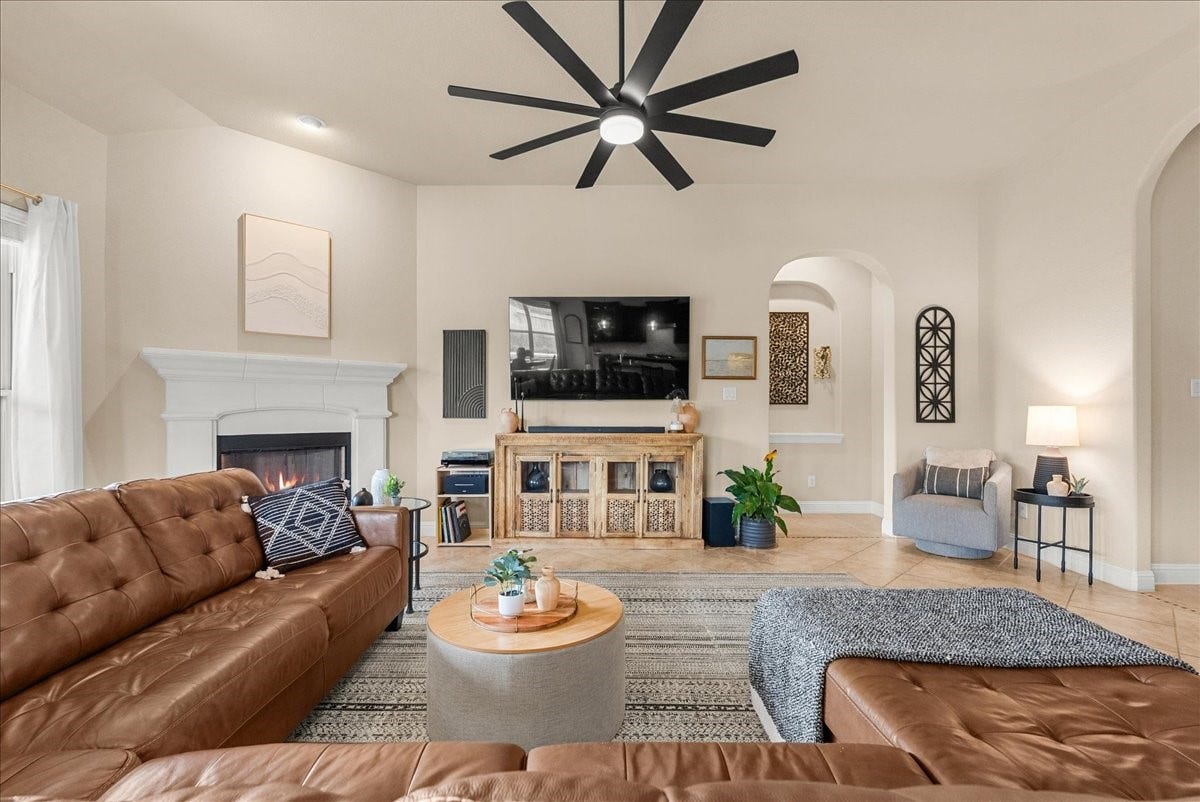 1413 Coffee Mill Court, League City, TX 77573 The open-concept living area features a cozy fireplace and flows seamlessly into the chef-inspired kitchen