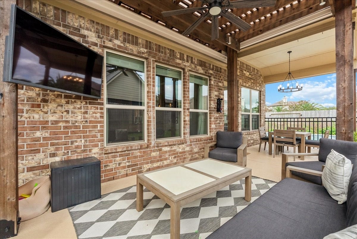 1413 Coffee Mill Court, League City, TX 77573 Step outside to your private backyard oasis featuring a sparkling pool, extended patio perfect for entertaining, and plenty of additional yard space for the kids to play.