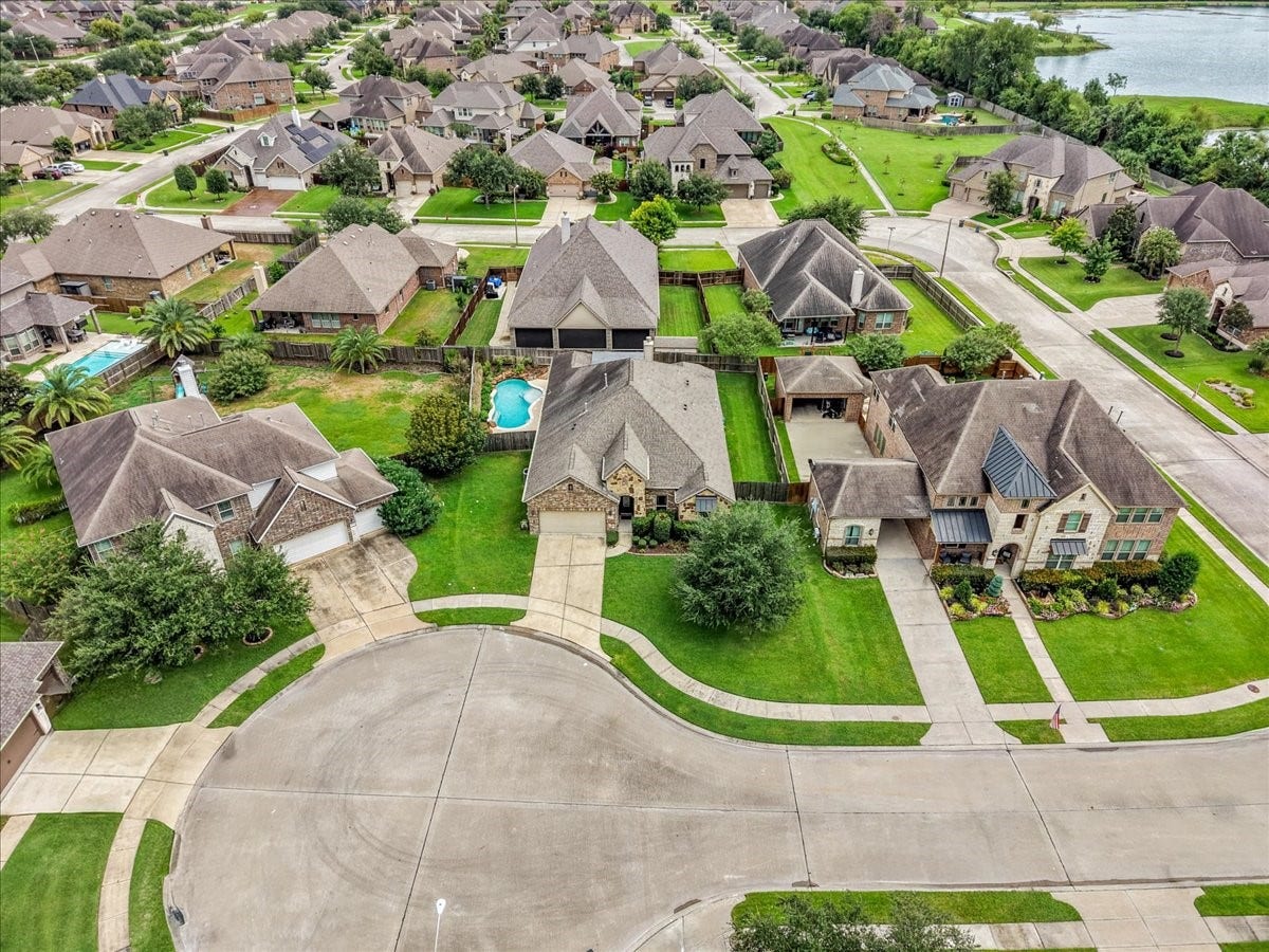 1413 Coffee Mill Court, League City, TX 77573 Welcome to this stunning and immaculately maintained single-story retreat nestled on a 0.23-acre cul-de-sac lot with a sparkling private pool and extended covered patio.
