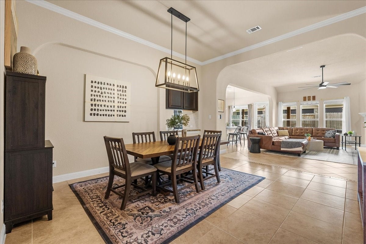1413 Coffee Mill Court, League City, TX 77573 The formal dining area is conveniently located just off the living room and kitchen, creating a seamless flow thats perfect for both everyday living and entertaining.