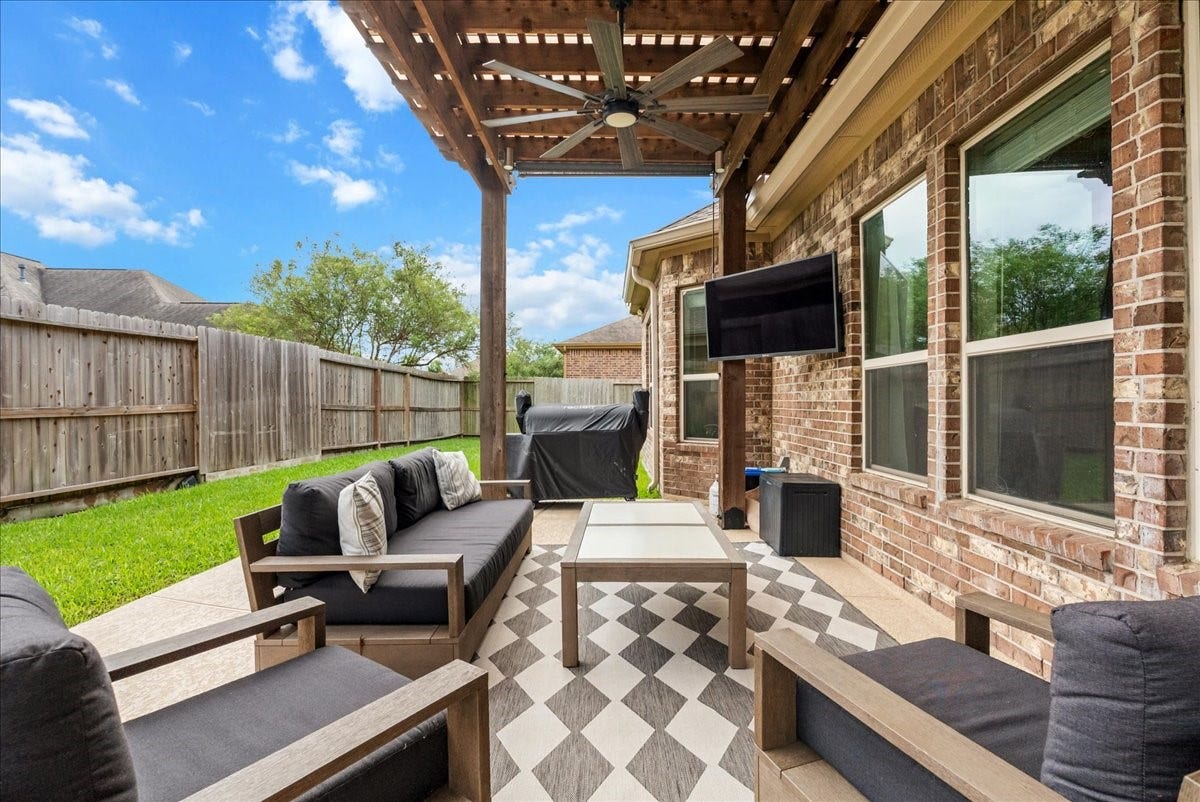 1413 Coffee Mill Court, League City, TX 77573 Step outside to your private backyard oasis featuring a sparkling pool, extended patio perfect for entertaining, and plenty of additional yard space for the kids to play.