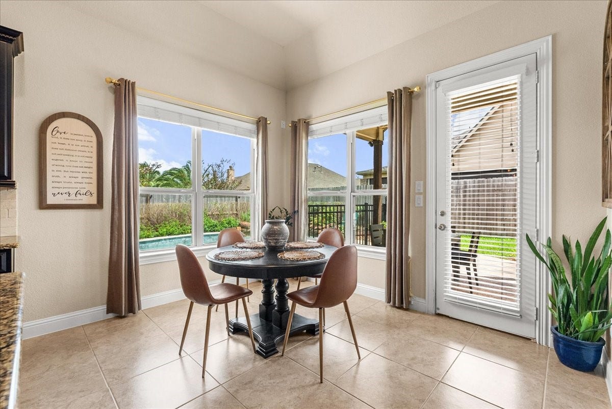 1413 Coffee Mill Court, League City, TX 77573 Enjoy morning coffee in the breakfast area overlooking the backyard oasis.