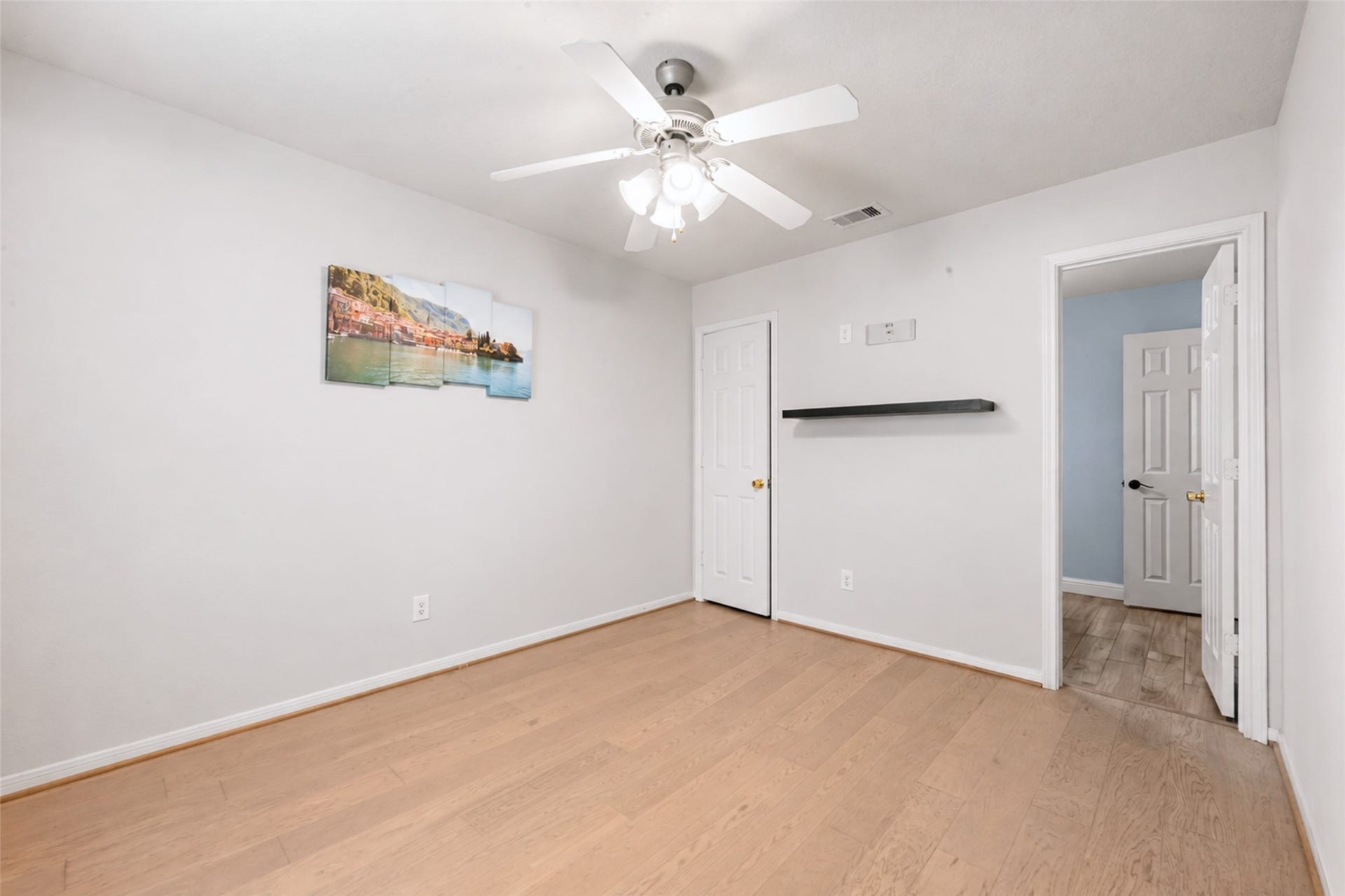 First-floor secondary bedroom with adjacent full bath