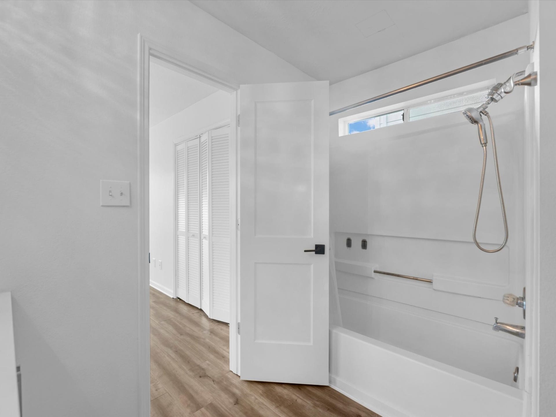 primary bathroom features a tub/shower combo and linen closet for storage!