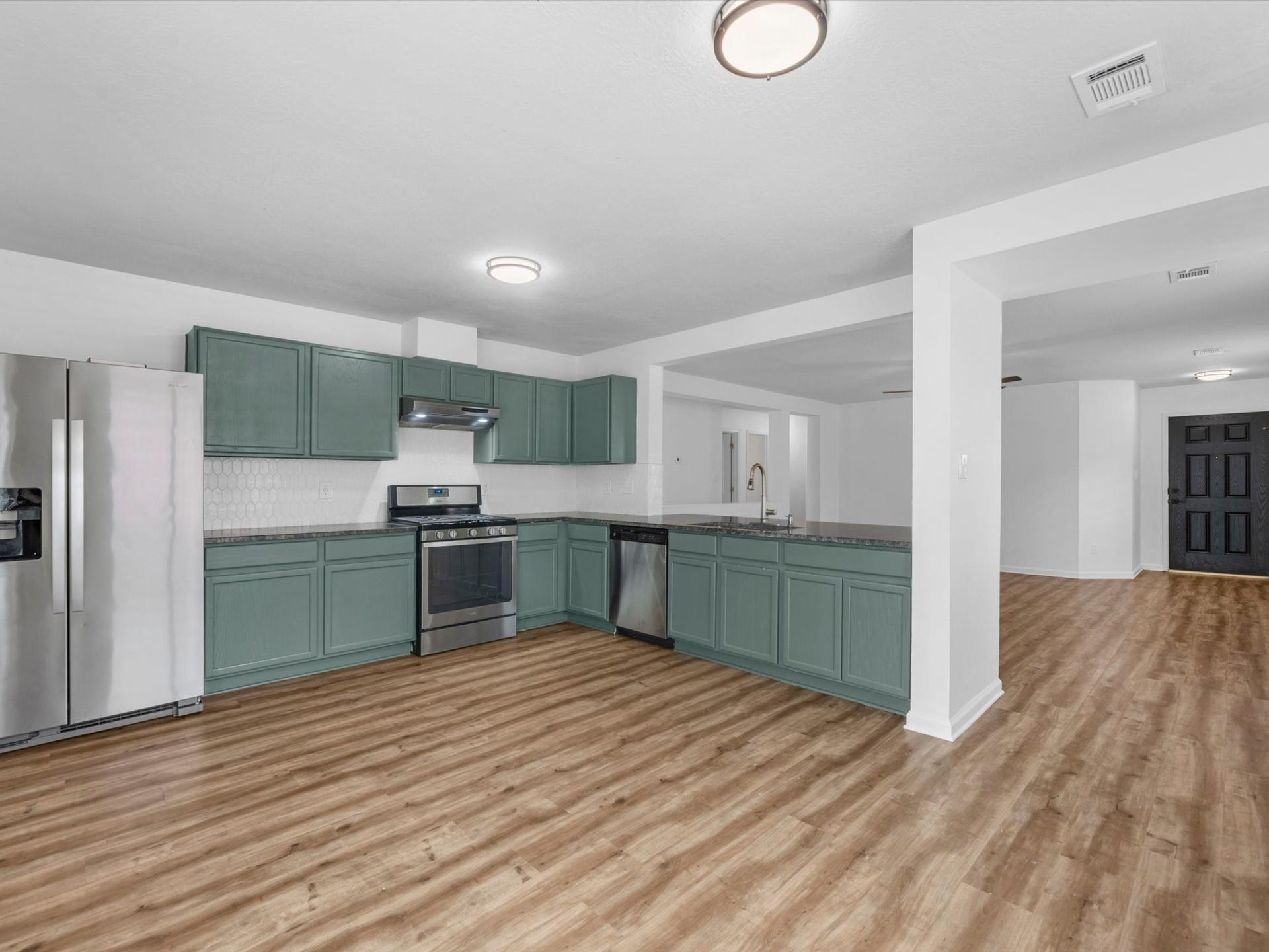Kitchen has been updated with fresh paint, new countertops and backsplash! Fridge is included. Updated light fixtures throughout the home!