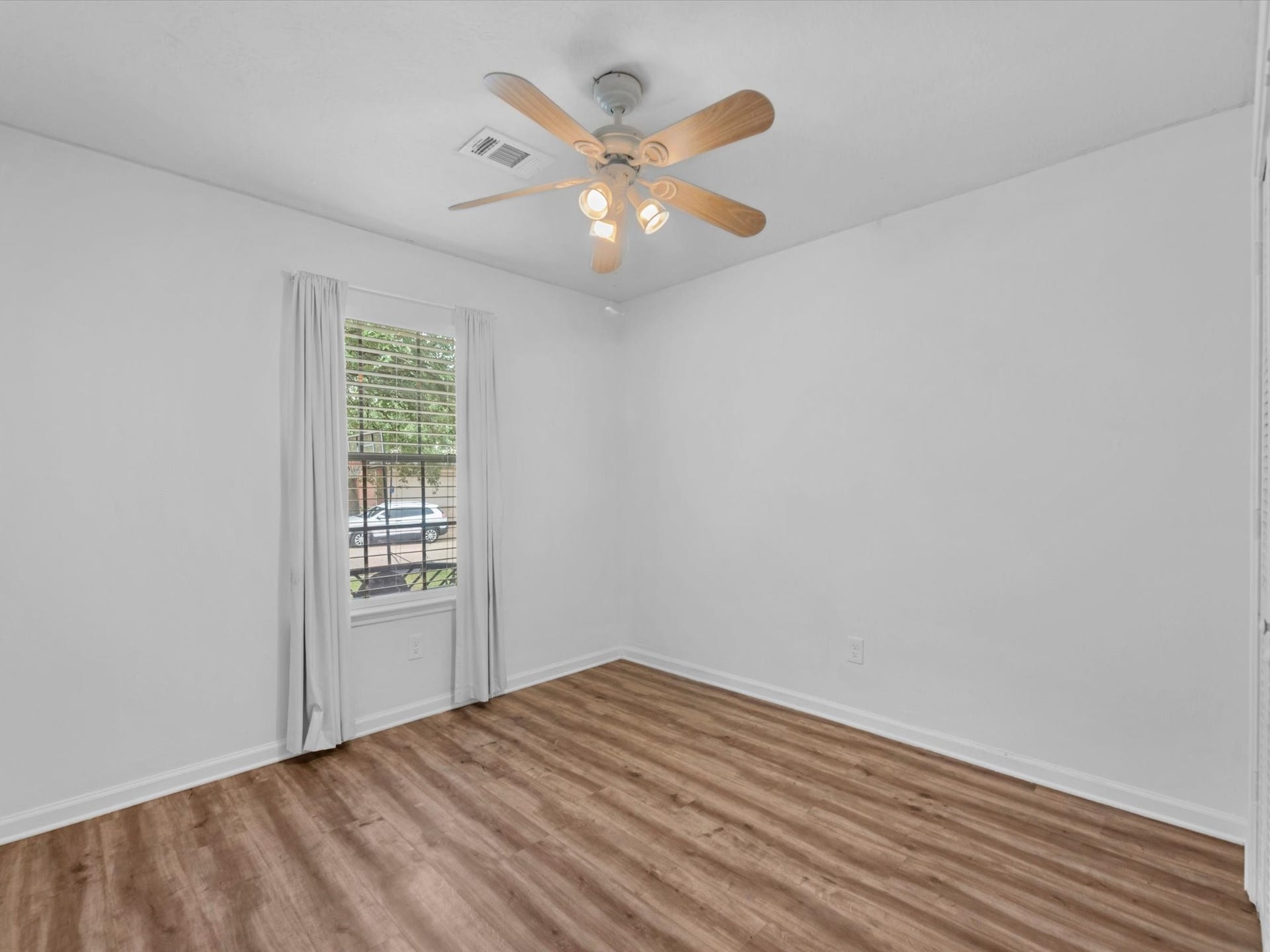 secondary bedroom has a ceiling fan for added comfort
