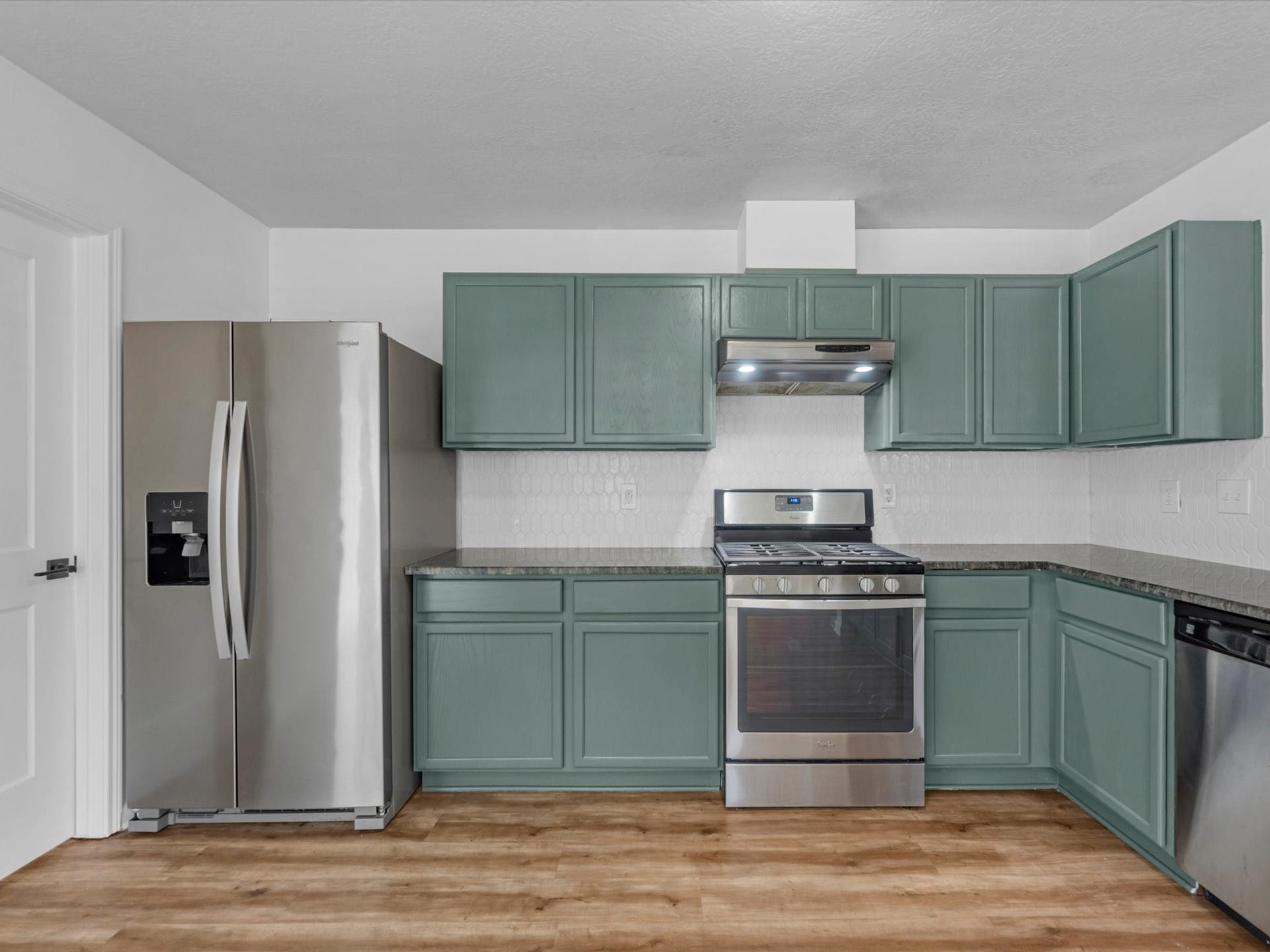 Kitchen has been updated with fresh paint, new countertops and backsplash! Fridge is included. Updated light fixtures throughout the home!