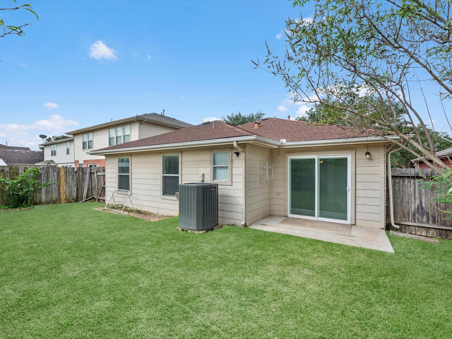 Spacious backyard has a small patio to sit and relax!