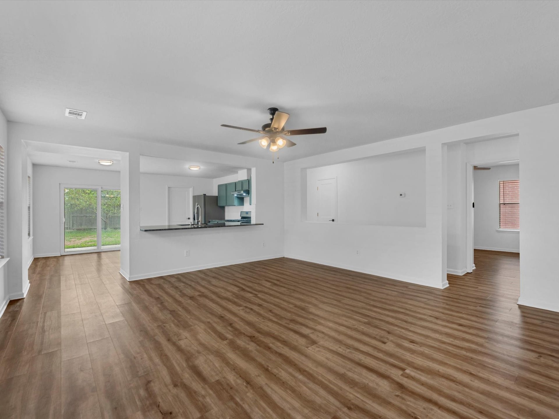 Wow! Look at all this space! Living room is perfect for hosting or spending a cozy night in.