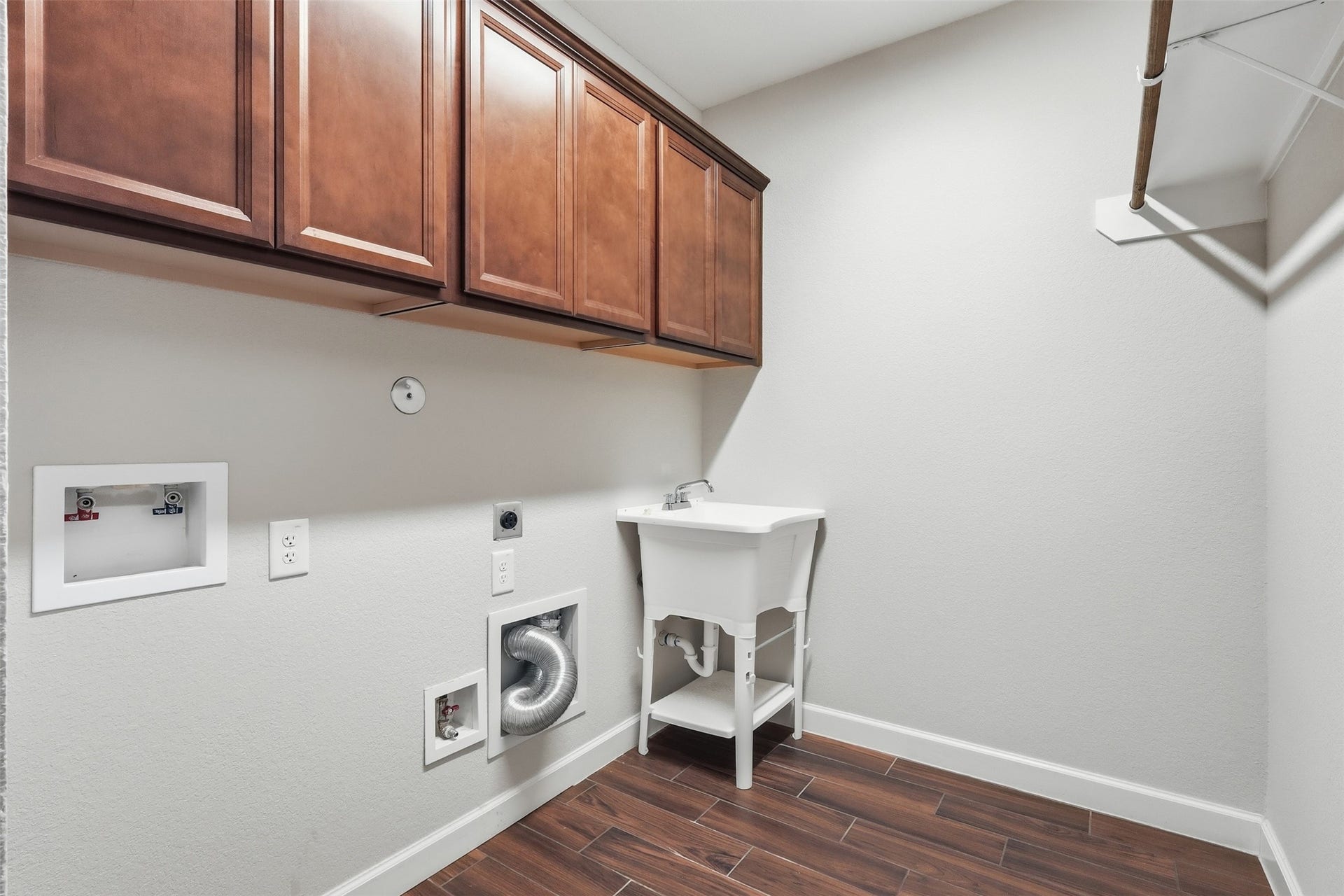 Spacious Laundry Room with custom installed sink