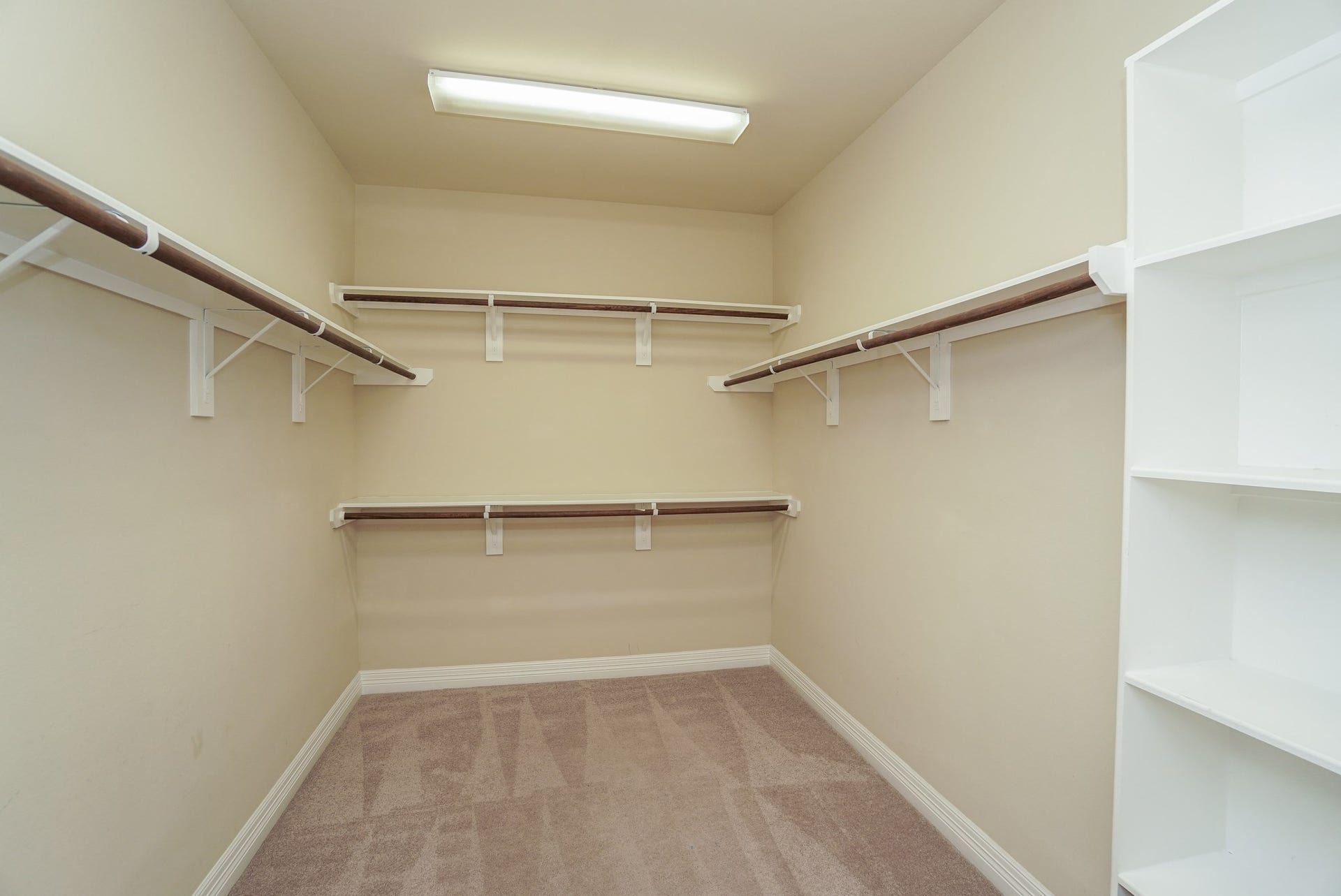 3434 Norwich Gardens Lane, Fulshear, TX 77441 The Primary Bedroom closet has a built in shelf and EXTRA storage under the staircase.