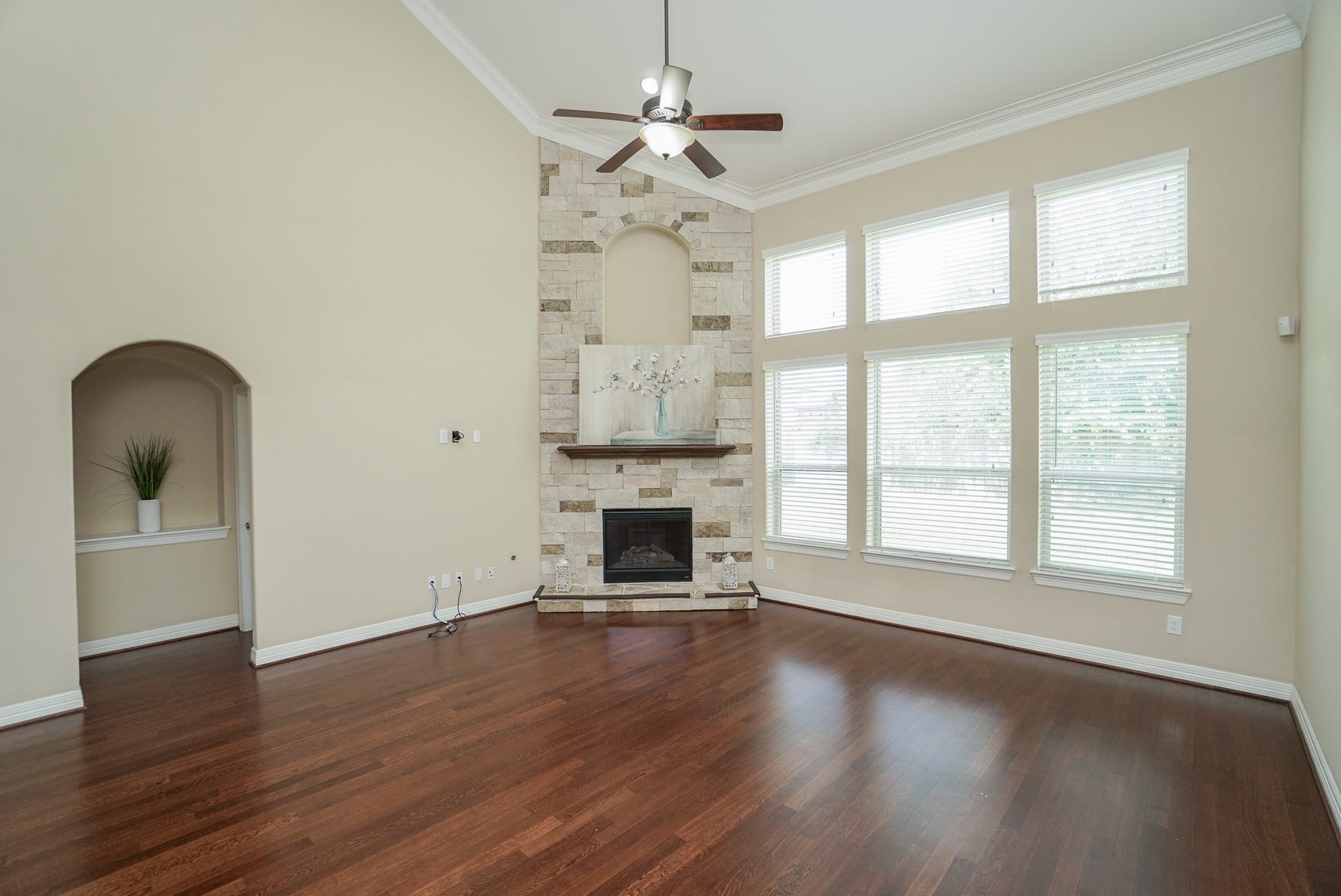 3434 Norwich Gardens Lane, Fulshear, TX 77441 You will fall in love with the gas fireplace and stunning stone work in this living room.