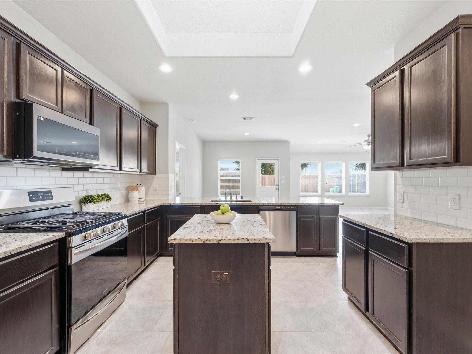 3519 Mcdonough Way, Katy, TX 77494 Tons of cabinets and counters. Skylight illuminates your prep island!