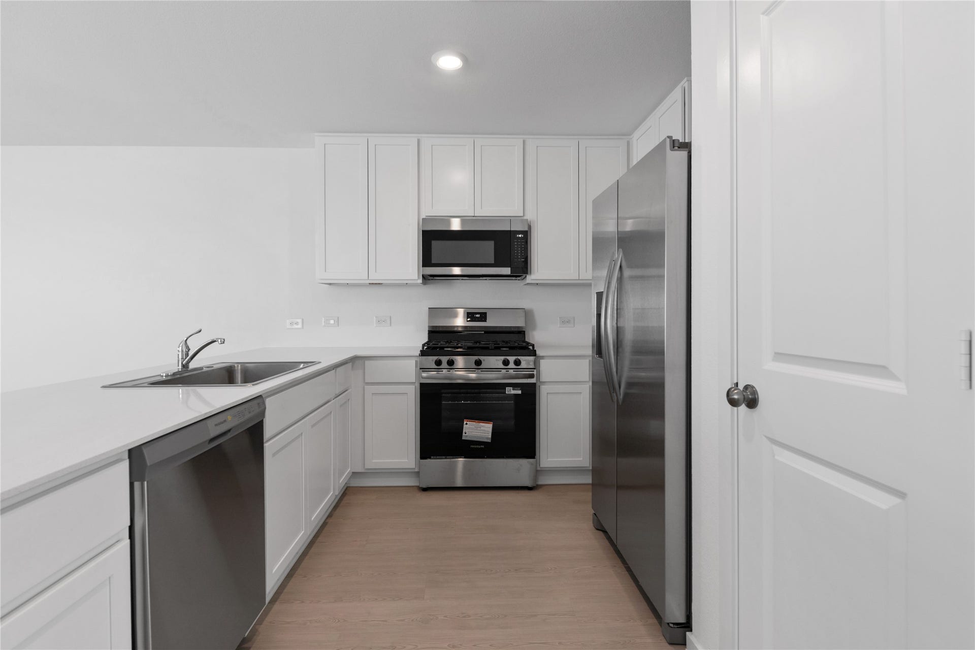 9203 Burch Eagle Court, Baytown, TX 77521 Kitchen overview w/ stainless steel appliances