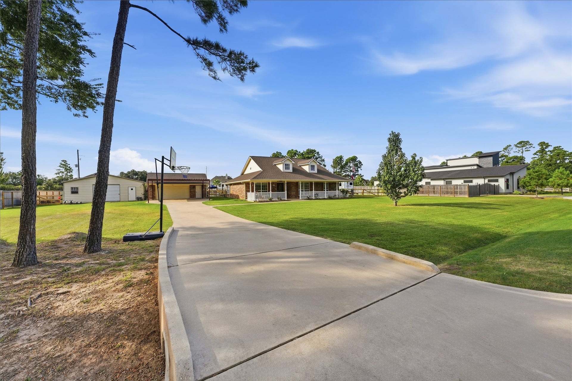 10711 Indian Trails Drive, Tomball, TX 77375 A long driveway welcomes you home with extra room for guest parkingmaking it easy to host gatherings and enjoy your acre of space.
