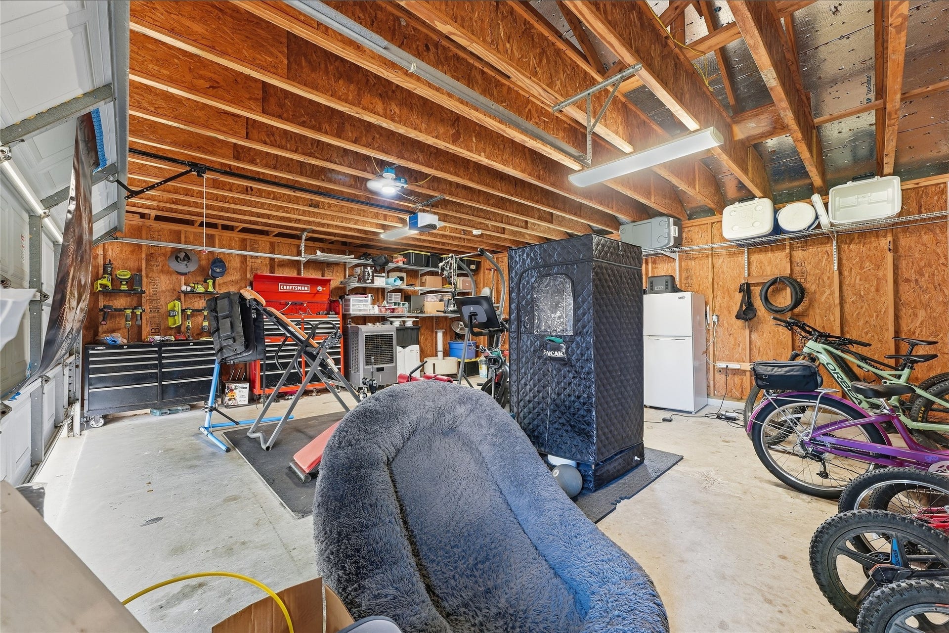 10711 Indian Trails Drive, Tomball, TX 77375 This air-conditioned two-car garage offers comfortable space for your vehicles, a home gym or hobbies, with covered parking directly in front for added flexibility.