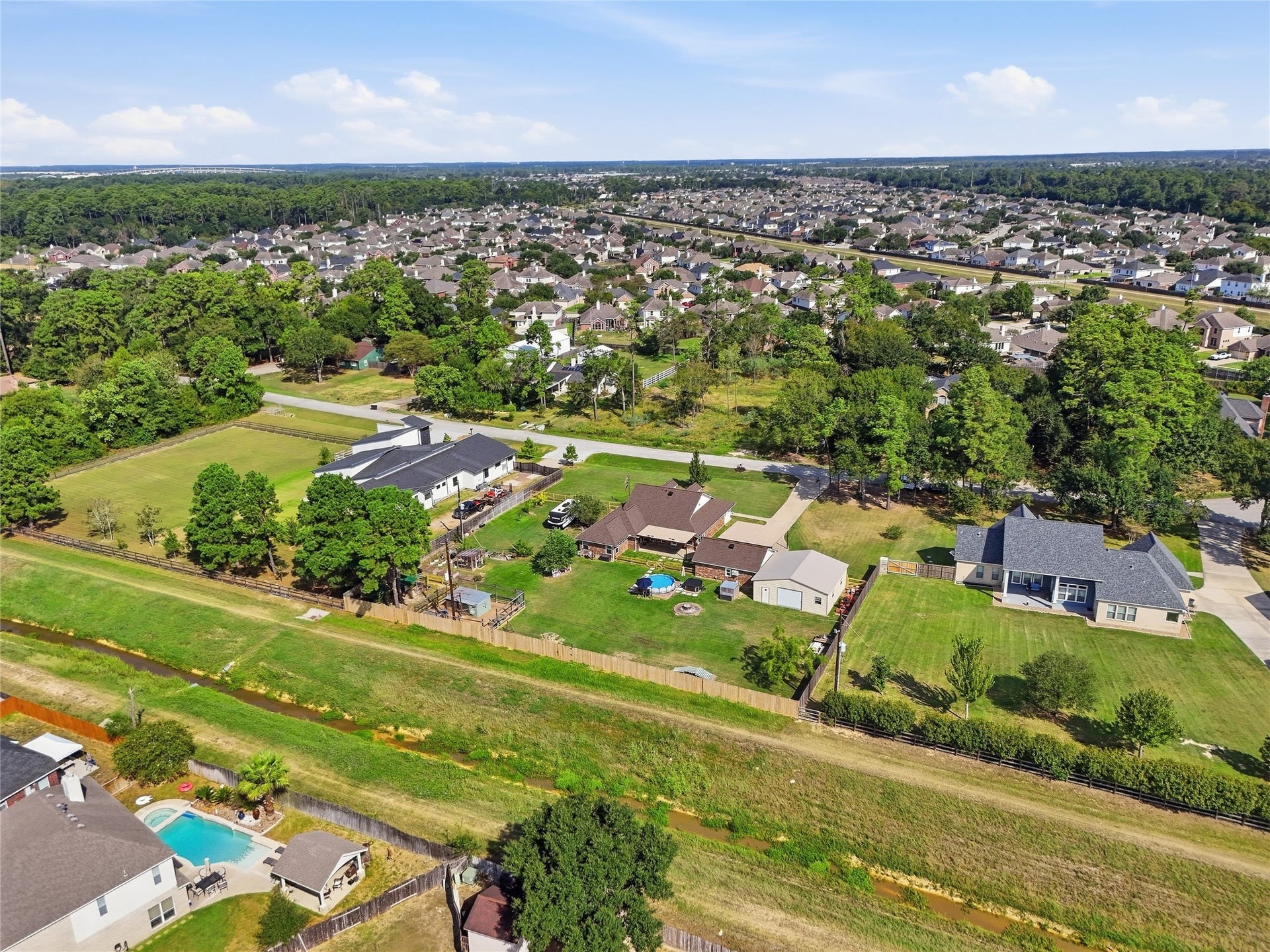 10711 Indian Trails Drive, Tomball, TX 77375 Enjoy a fully fenced backyard with no rear neighbors and convenient gate access to the jogging and biking trail behind the property.