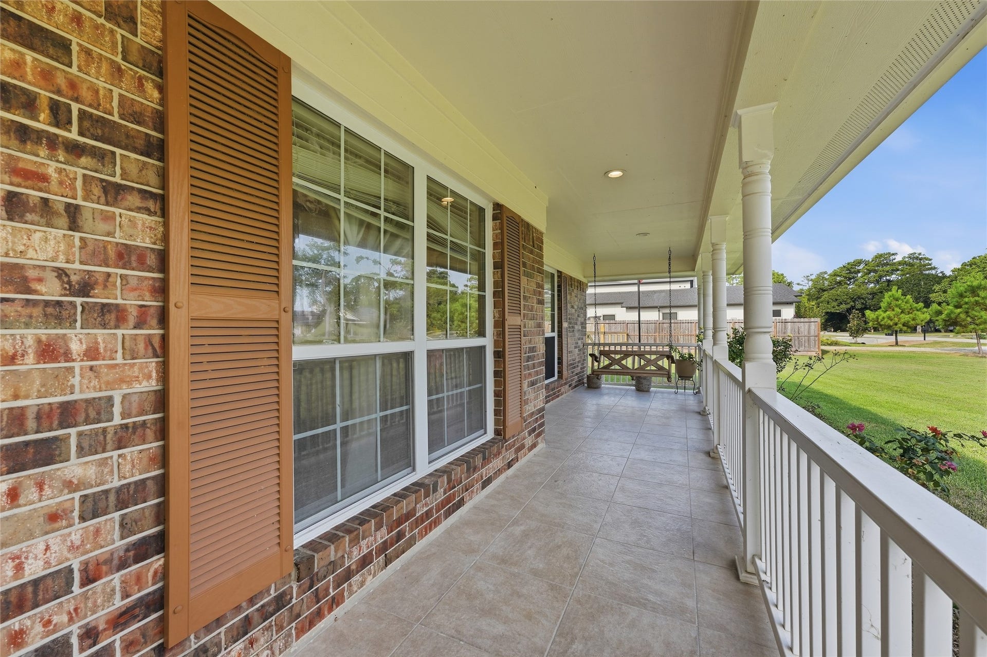 10711 Indian Trails Drive, Tomball, TX 77375 The kind of porch that feels like a peaceful retreata place to slow down, sip your coffee and stay awhile.