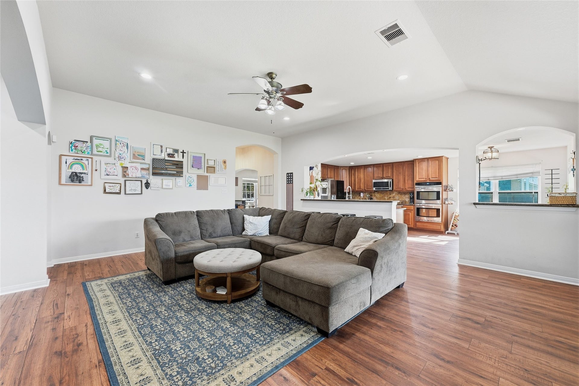 10711 Indian Trails Drive, Tomball, TX 77375 Vaulted ceilings give the family room a spacious, airy feel, while abundant natural light and an open layout create a bright, welcoming space for everyday living and entertaining.