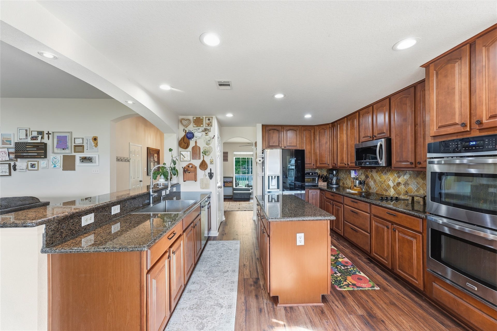 10711 Indian Trails Drive, Tomball, TX 77375 This recently updated kitchen offers generous cabinet space, a practical layout, granite countertops, a stainless-steel sink and coordinating stainless-steel appliancesready for everyday meals and entertaining.
