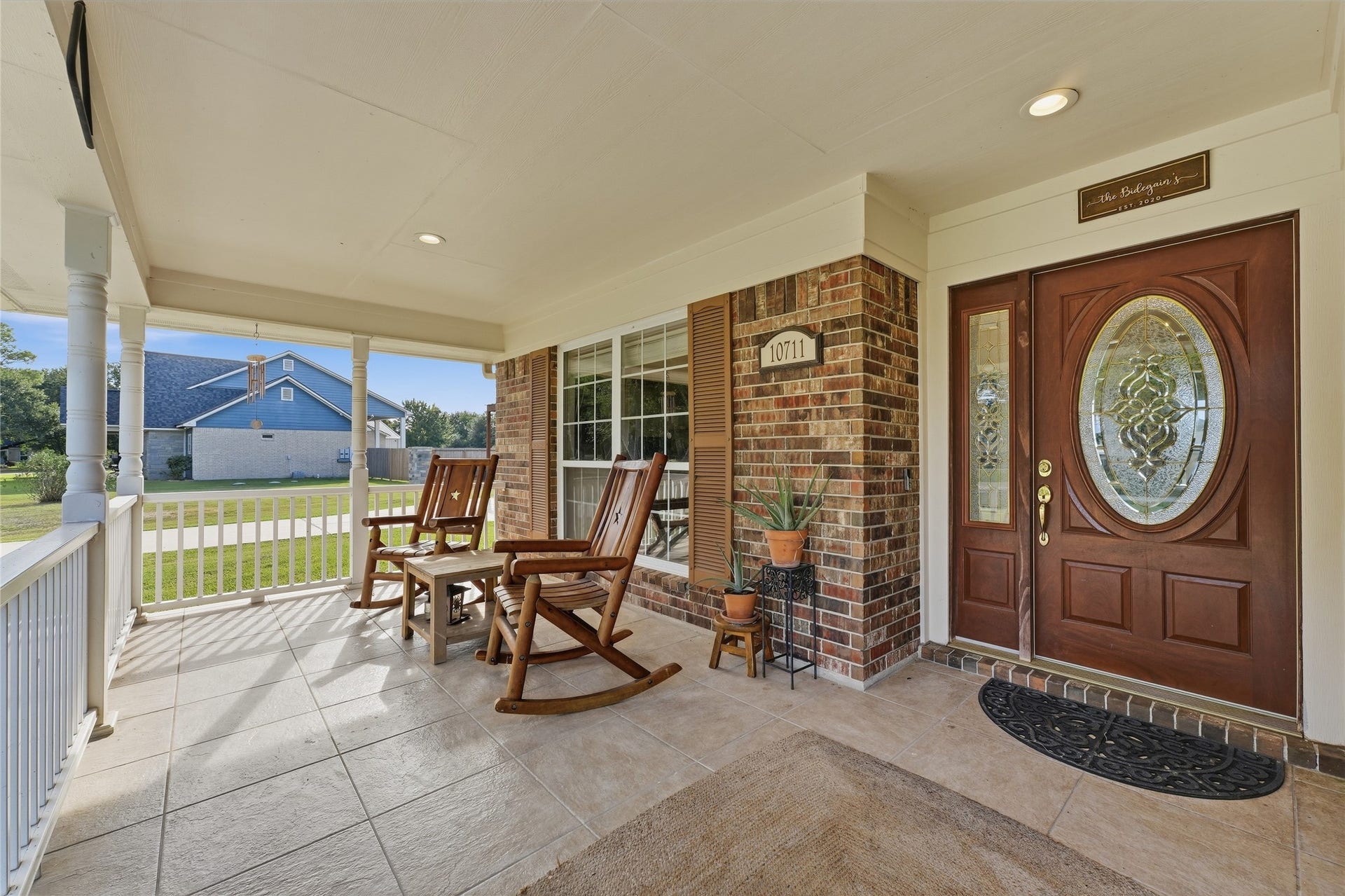 10711 Indian Trails Drive, Tomball, TX 77375 A spacious covered front porch invites you to slow down and enjoy the country lifestyle, with room for rocking chairs, morning coffee and gathering with guests.
