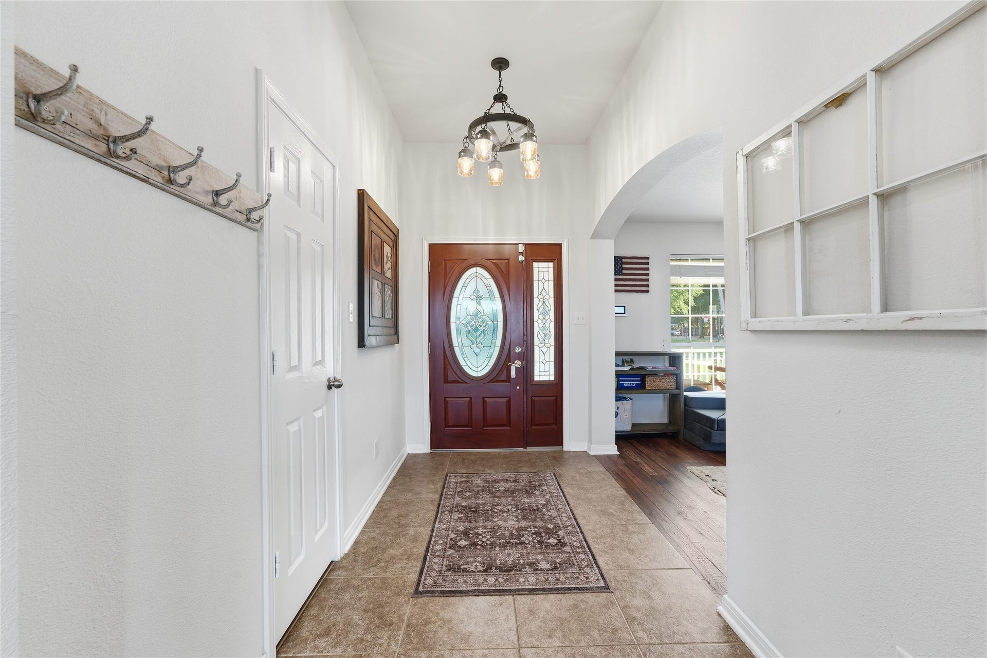 10711 Indian Trails Drive, Tomball, TX 77375 Entry with ceramic tile flooring and a convenient hall closet to keep coats and everyday essentials tucked away.