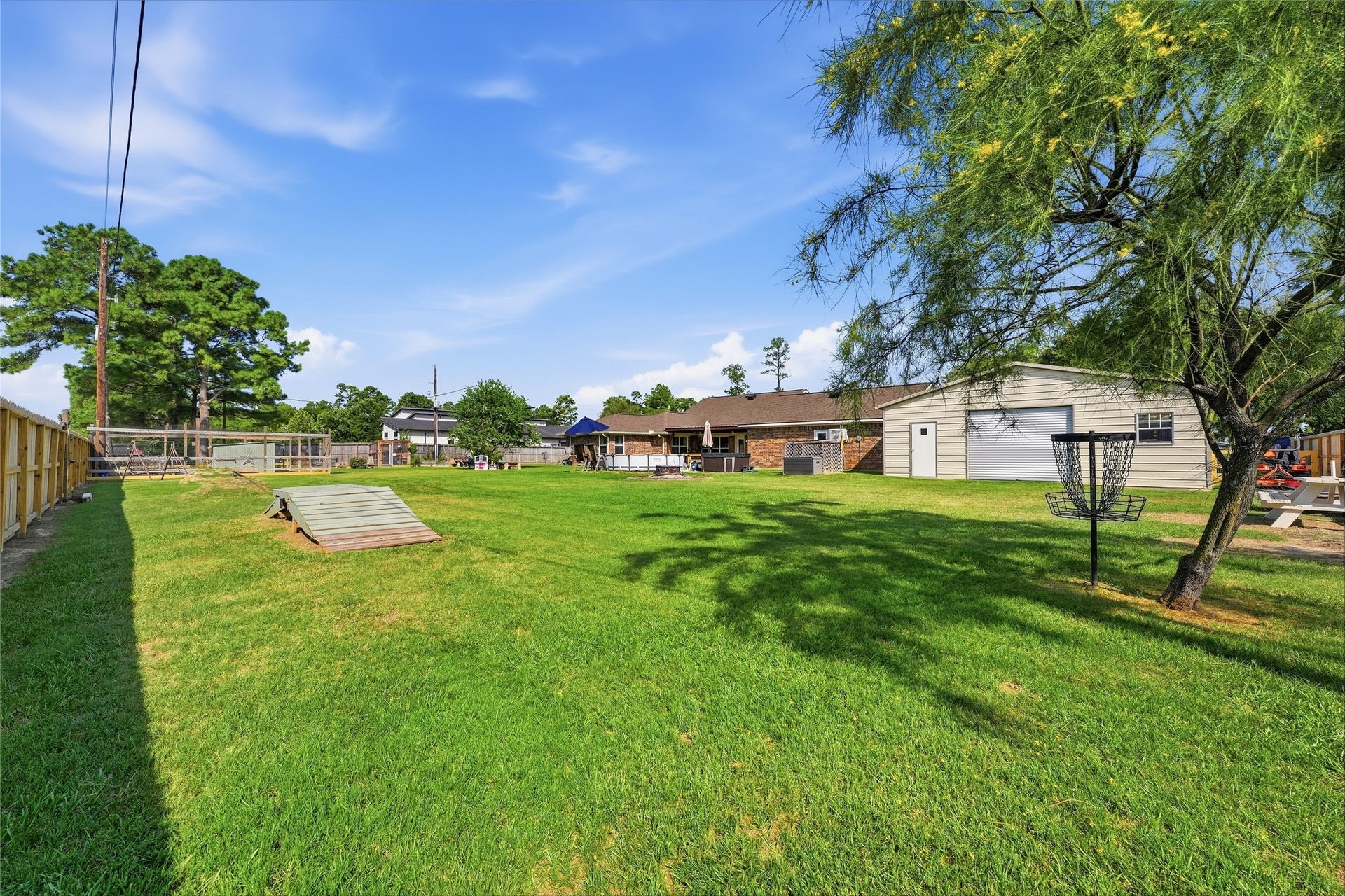 10711 Indian Trails Drive, Tomball, TX 77375 With no rear neighbors and gate access to the jogging and biking path, this backyard opens the door to more outdoor adventuresperfect for those who love an active lifestyle.