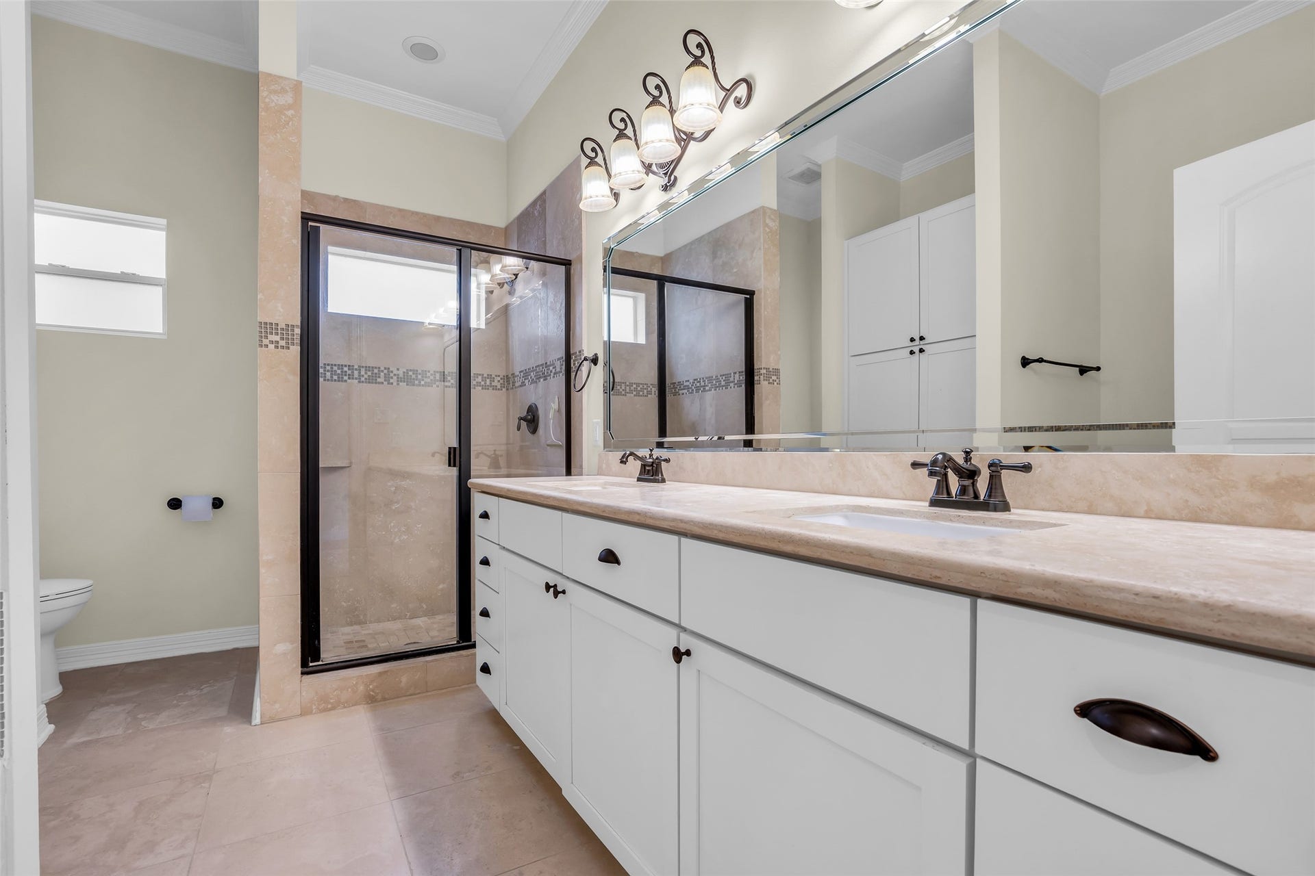 1423 Colorado Street, Houston, TX 77007 Primary bathroom features an enclosed shower, dual sinks, ample storage space, and modern fixtures, designed for comfort and everyday convenience.