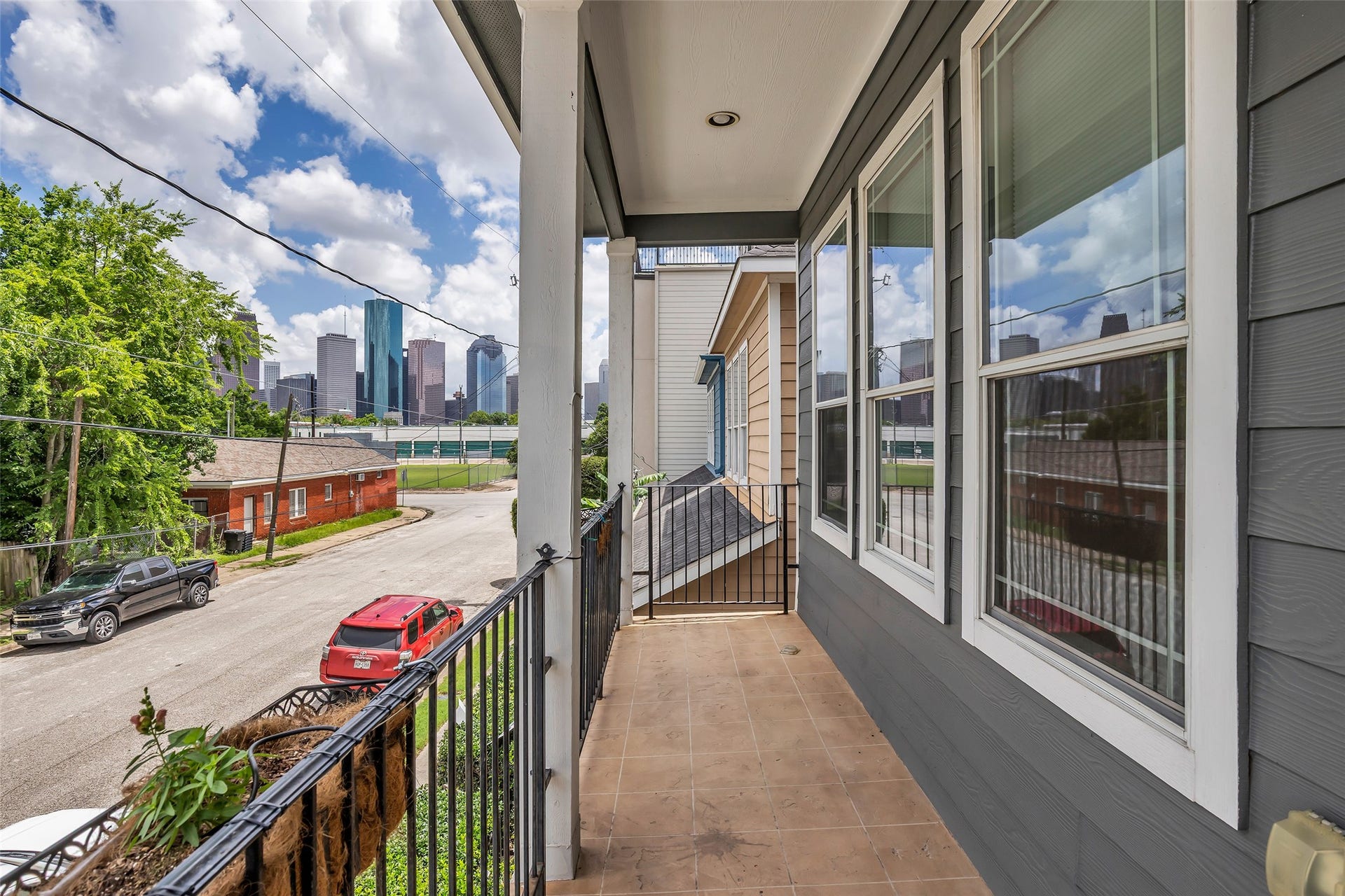 1423 Colorado Street, Houston, TX 77007 View from the second-floor balcony overlooks the street and surrounding neighborhood, offering an open outlook and a sense of the areas setting.