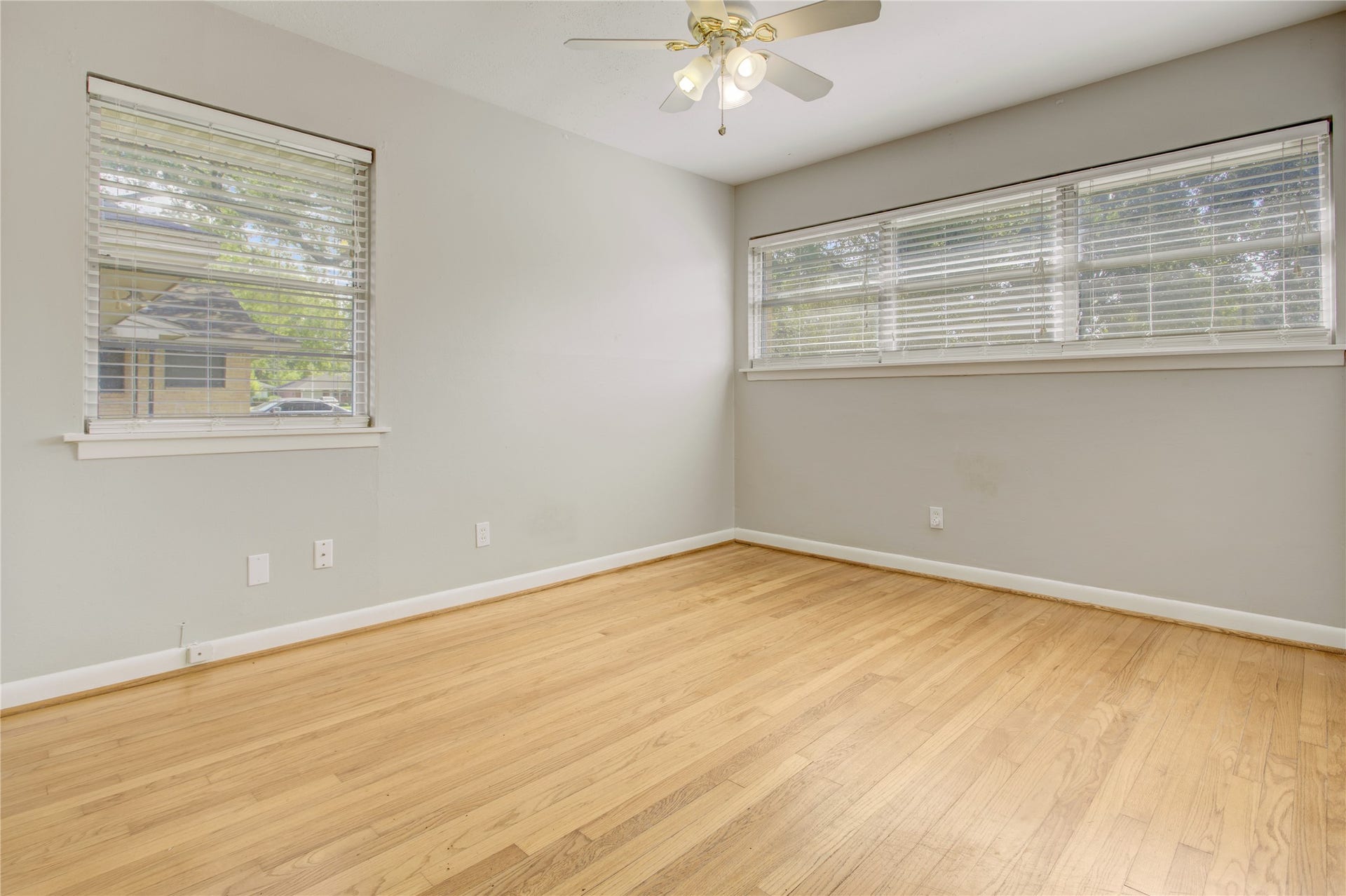 4314 Benning Drive, Houston, TX 77035 Southeast corner secondary bedroom with four windows, ceiling fan, two closets