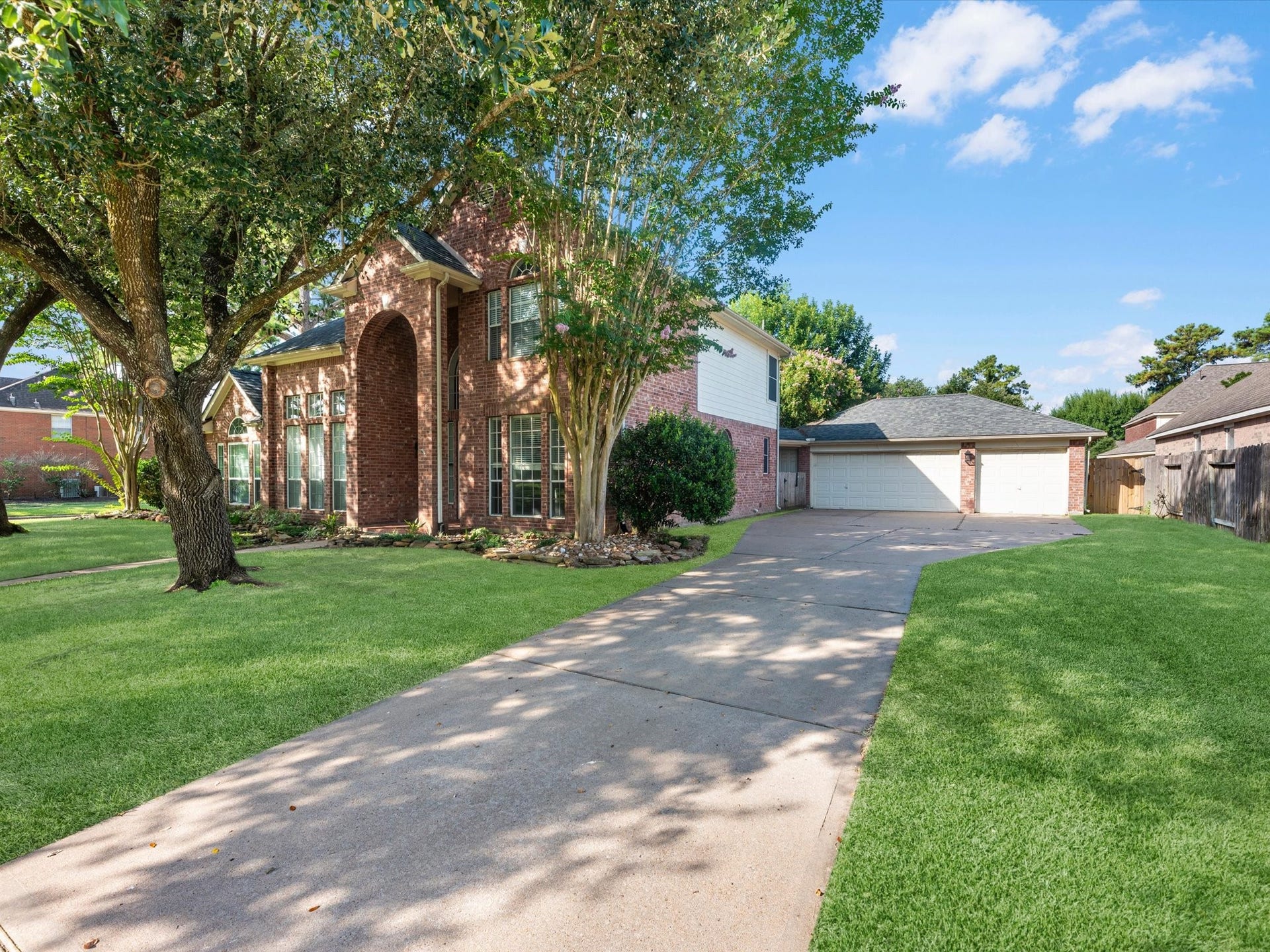 15603 Twisting Springs Drive, Cypress, TX 77433 Large private driveway leading to detached three car garage.