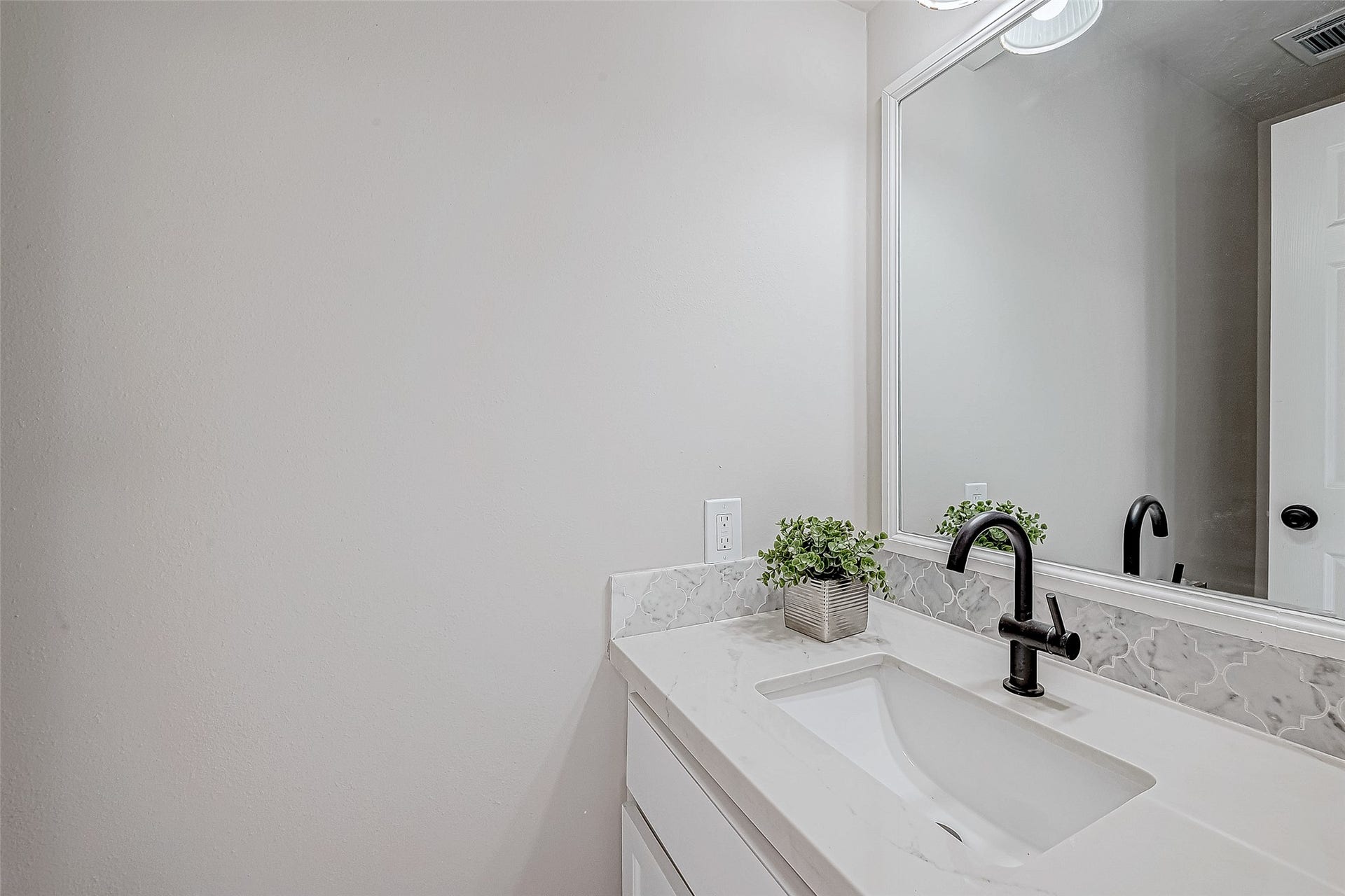 3102 Glenn Lakes Lane, Missouri City, TX 77459 Half Bath featuring a sleek vanity with a modern faucet.