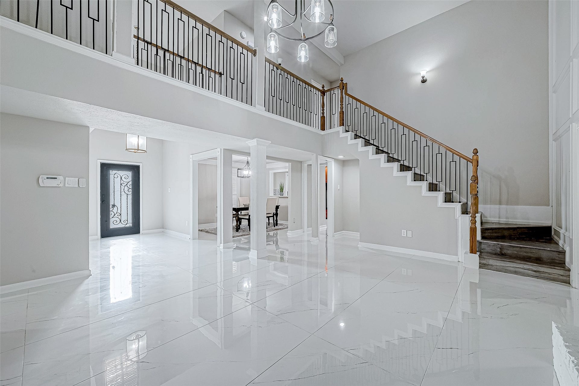 3102 Glenn Lakes Lane, Missouri City, TX 77459 Open foyer with tile flooring and a grand staircase.